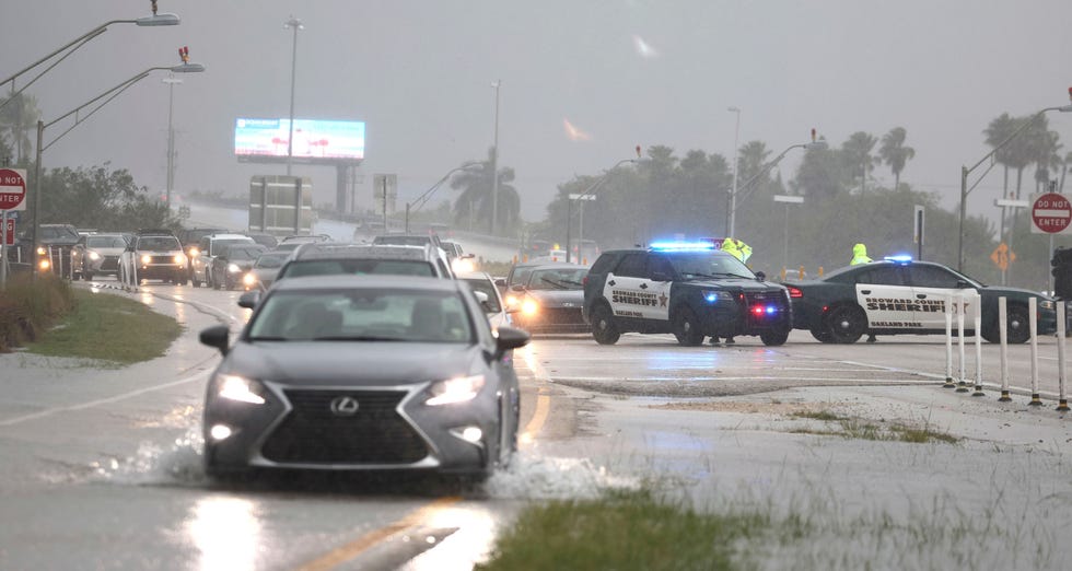 Broward Sheriff's Office deputies direct traffic away from the Fort Lauderdale-Hollywood International Airport, which has closed to all flights and traffic on Wednesday, April 12, 2023, in Fort Lauderdale, Fla.