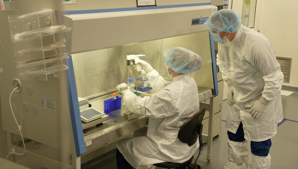 Moderna employees manufacture personalized cancer vaccines at the company's facility in Norwood, Massachusetts