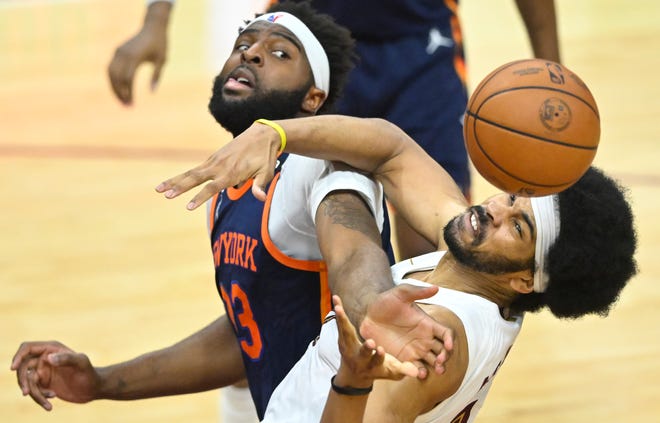 Game 1: New York Knicks center Mitchell Robinson and Cleveland Cavaliers center Jarrett Allen reach for a loose ball.