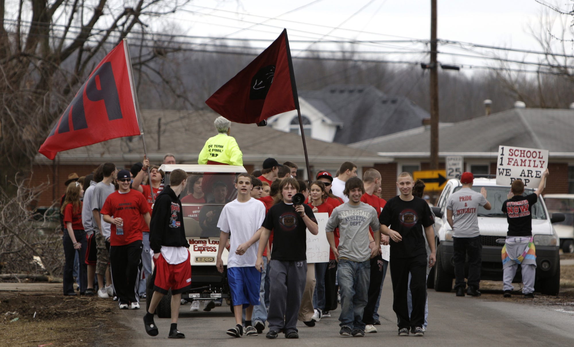 Students and friends of former Pleasure Ridge Park Coach David Jason Stinson walked from the school to his house to show their support._(By Scott Utterback, The Courier-Journal)_Feb. 07, 2009