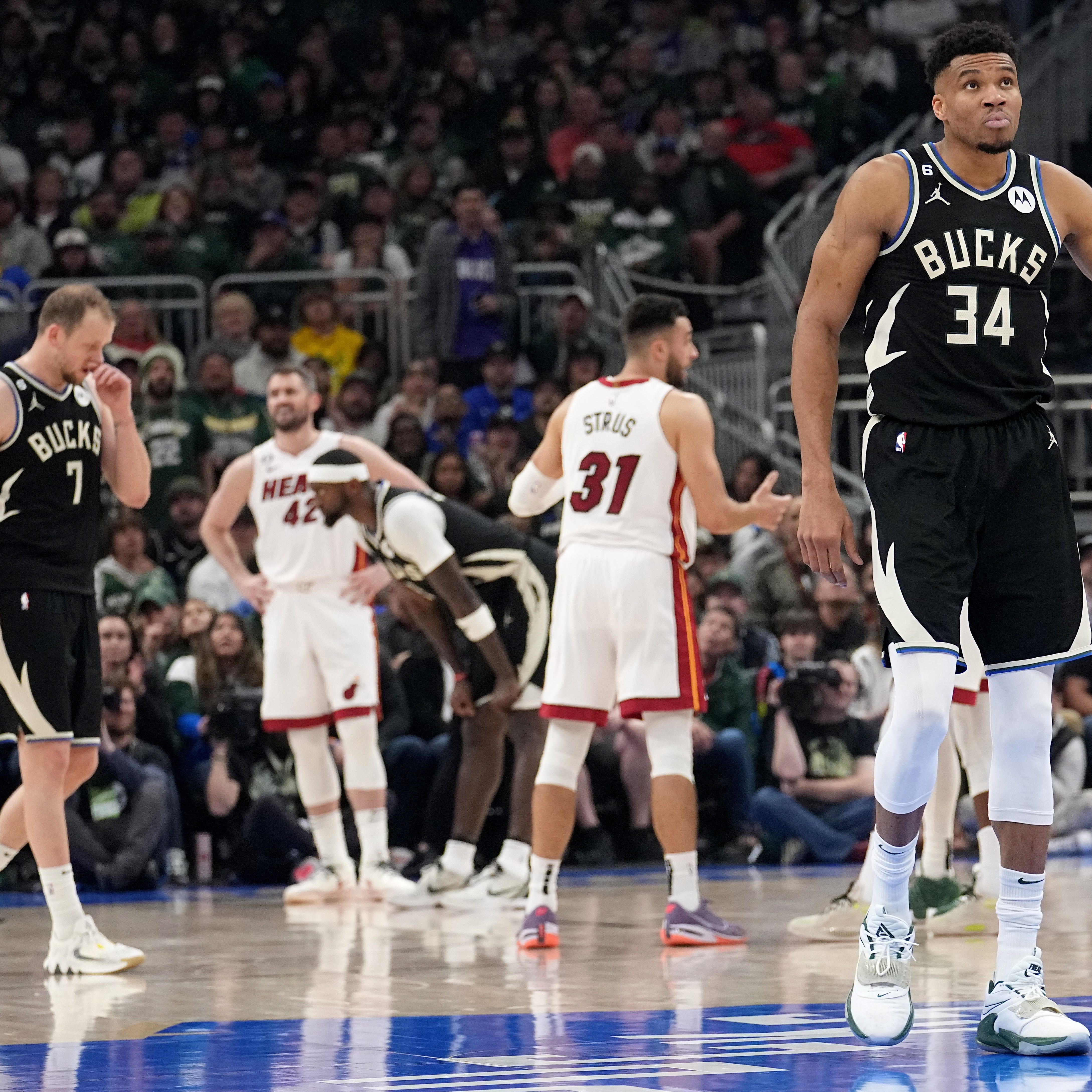 Milwaukee Bucks forward Giannis Antetokounmpo (34) takes a moment after fouled and injured during the first half of their game against the Miami Heat Sunday, April 16, 2023 at Fiserv Forum in Milwaukee, Wis.