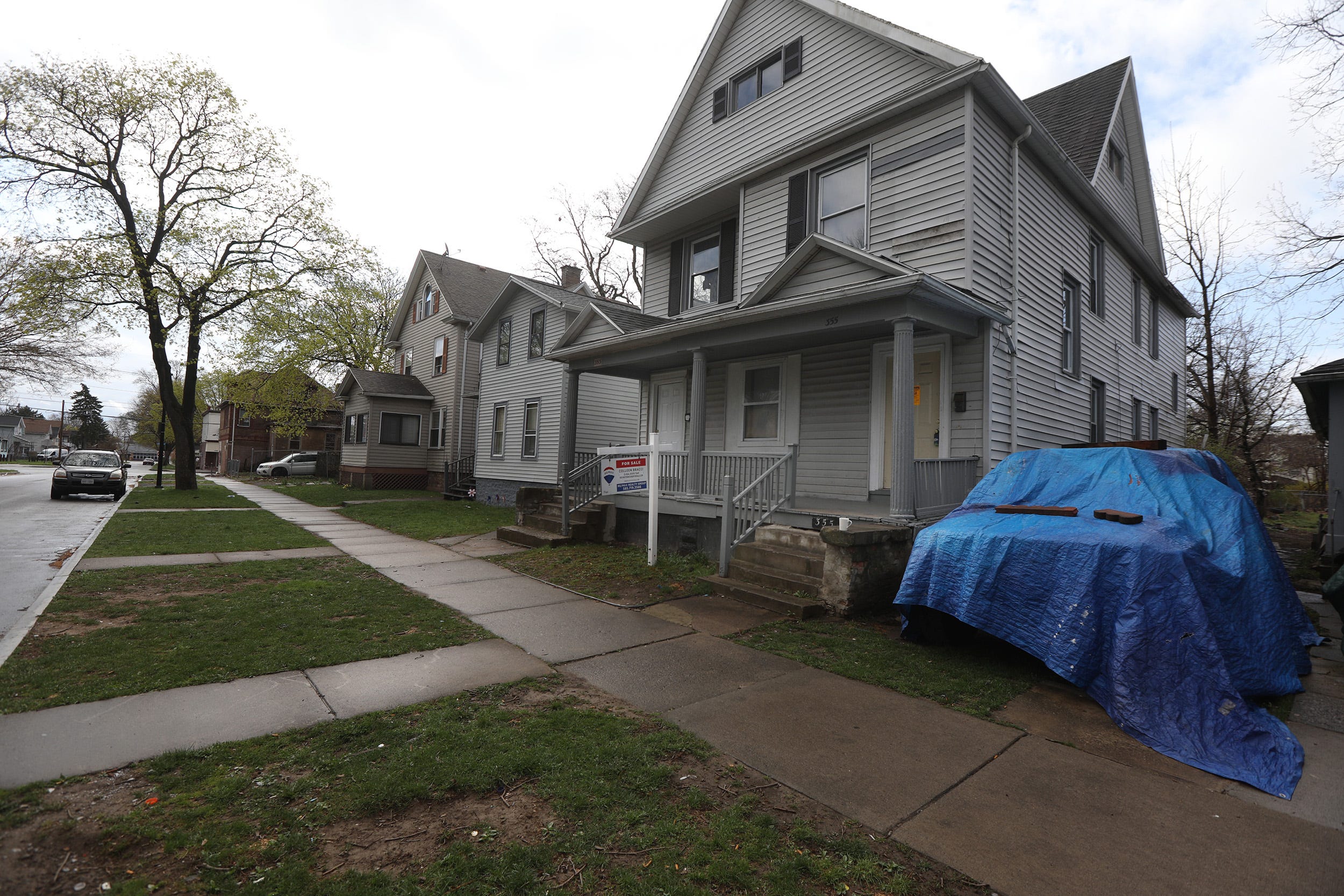 Domonique Holley-Grisham's family lived on the right side of this two-family home on Champlain Street. Today he would be 30.