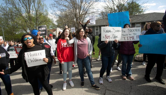 Protestors march Sunday in Kansas City to bring attention to the shooting of Ralph Yarl, 16, who was shot when he went to the wrong house to pick up his brothers.