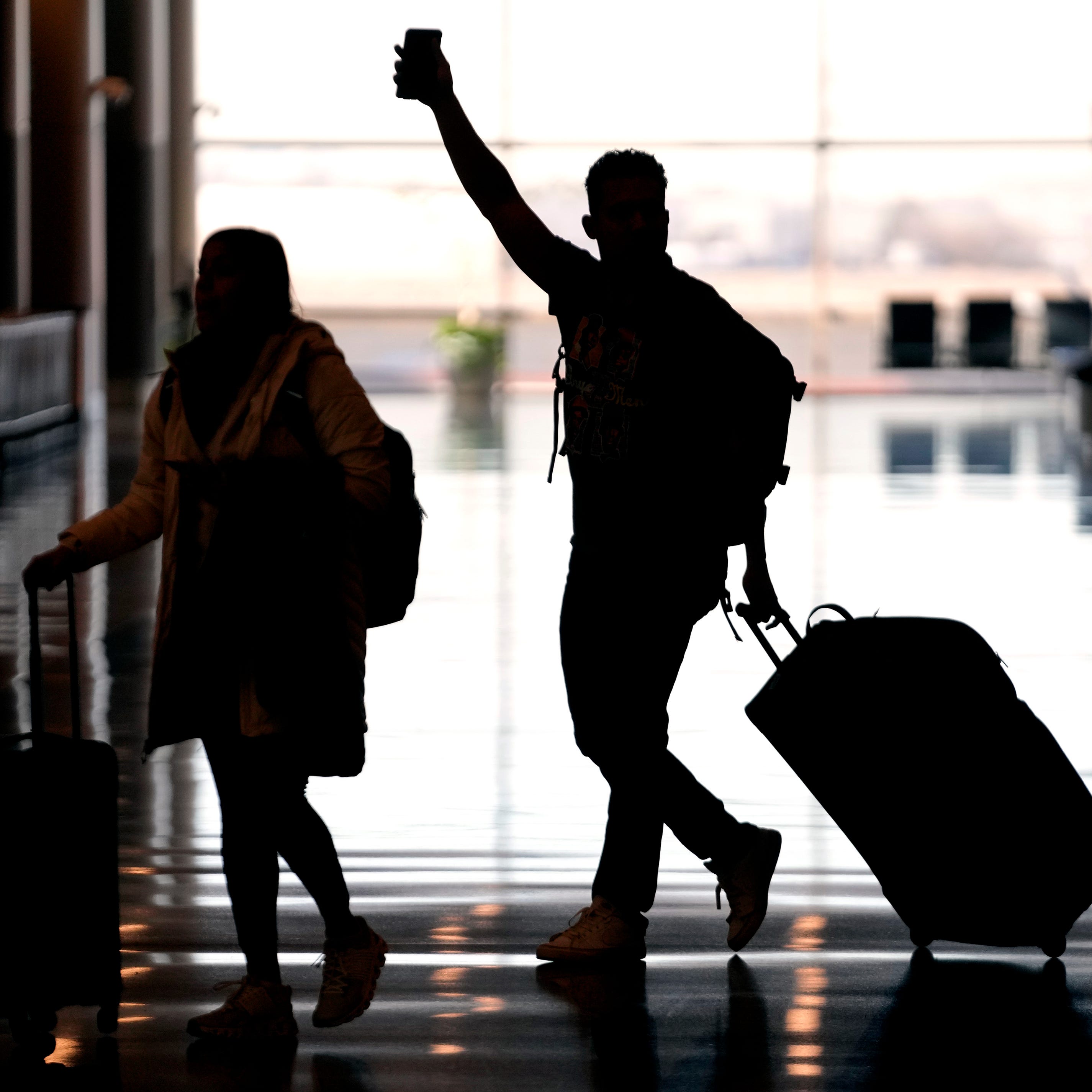 People pass through Salt Lake City International Airport on Jan. 11, 2023, in Salt Lake City. (AP Photo/Rick Bowmer, File)