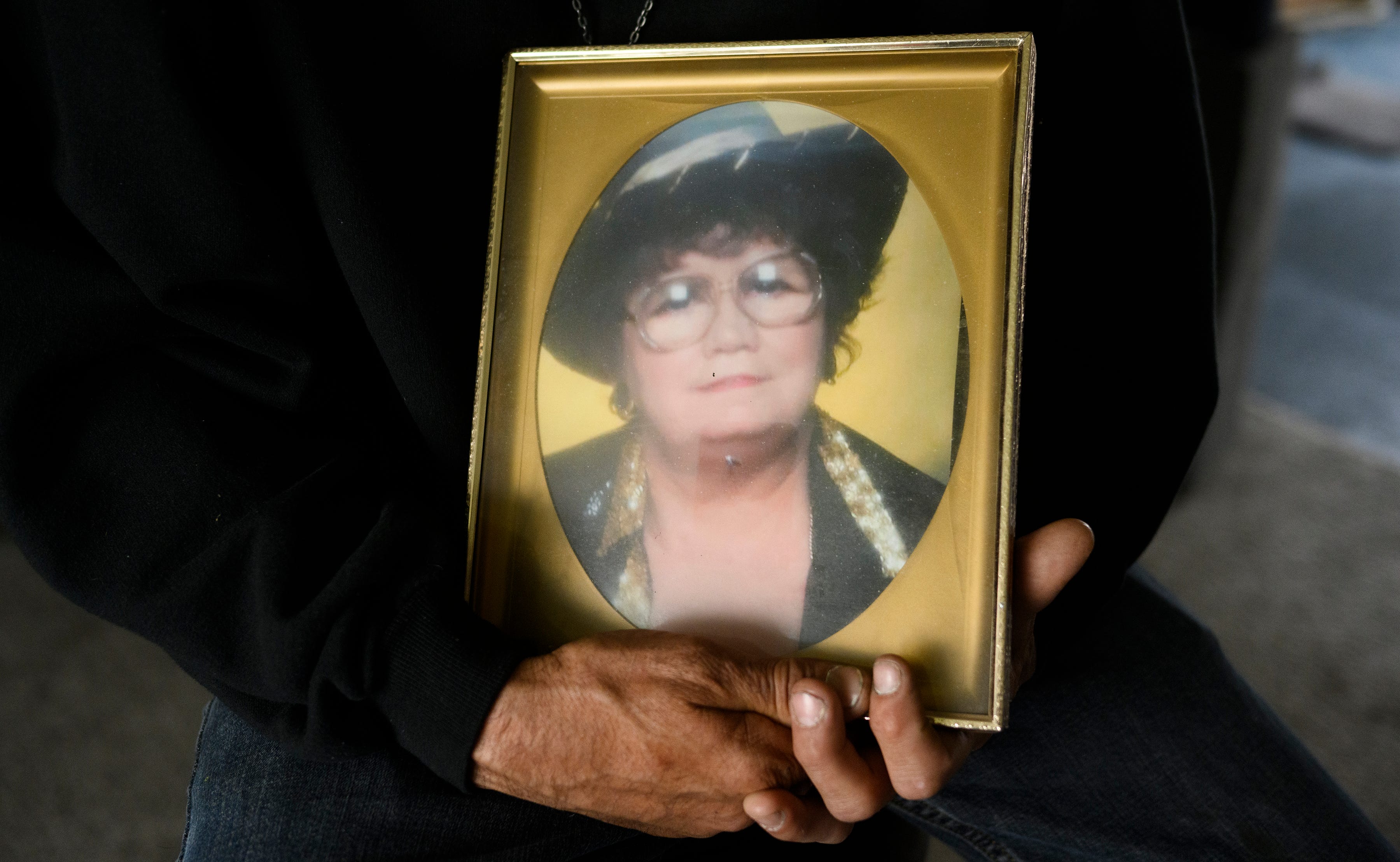 William Woods holds a photo of his mother, Johnnie, who died of respiratory failure on April 19, 2020, at Rivergate Terrace nursing home in Riverview.