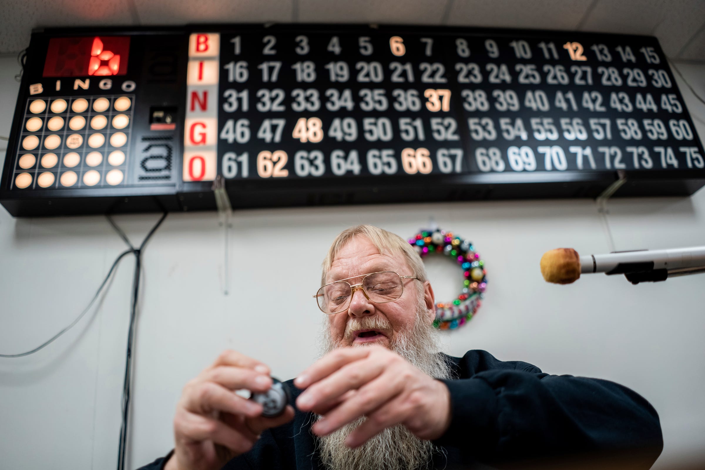 Dan Kohtala, of Ishpeming, calls the numbers during Friday night bingo at the Independent Order of Odd Fellows' building in Ishpeming on Friday, Feb. 10, 2023, in Michigan's Upper Peninsula.
