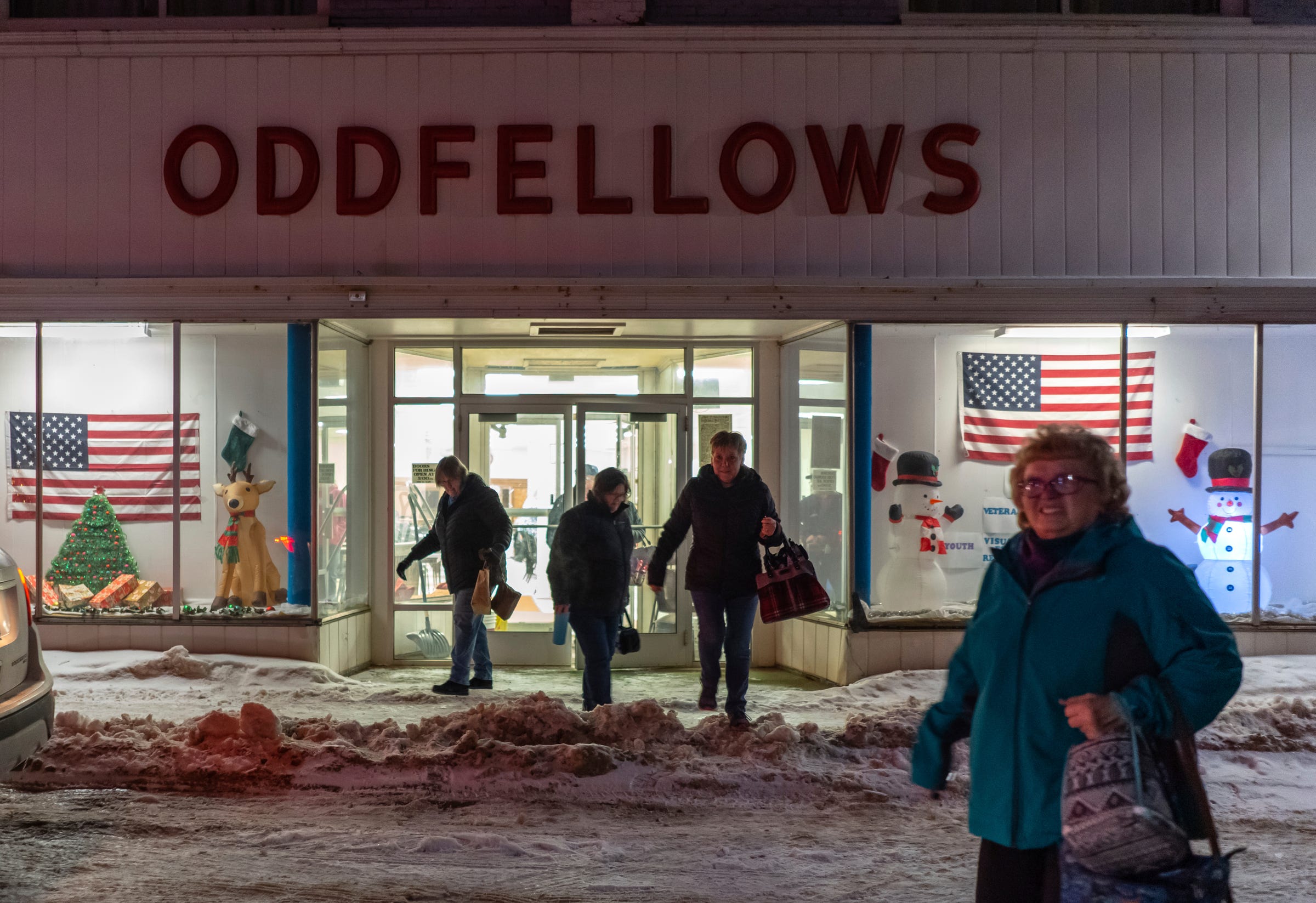 A group of women heads out after a night of bingo at the Odd Fellows building in Ishpeming on Friday, Feb. 10, 2023, in Michigan's Upper Peninsula.