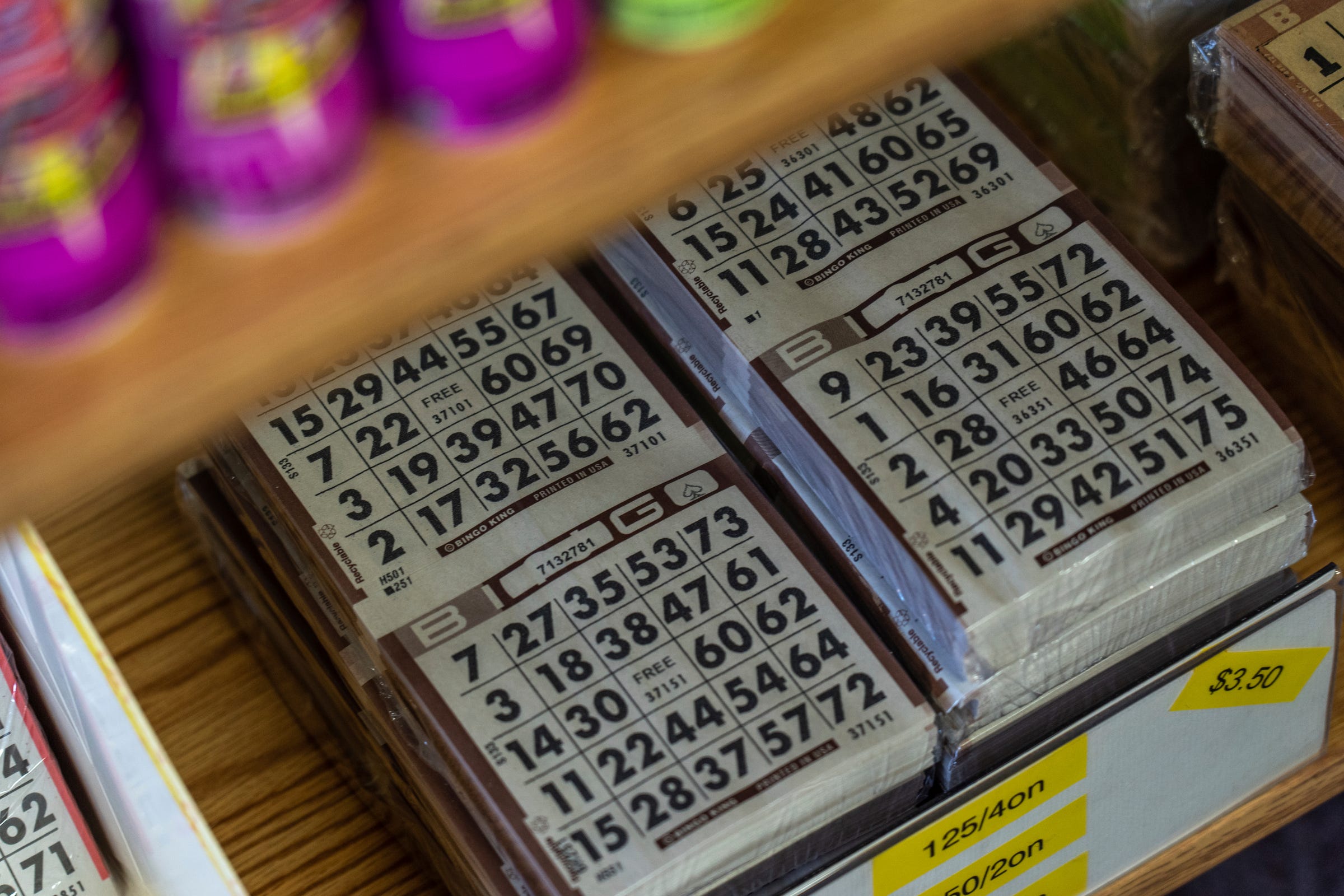 Packs of bingo cards sit neatly on a shelf at Higgins Bingo Supplies in Marquette on Friday, Feb. 10, 2023.