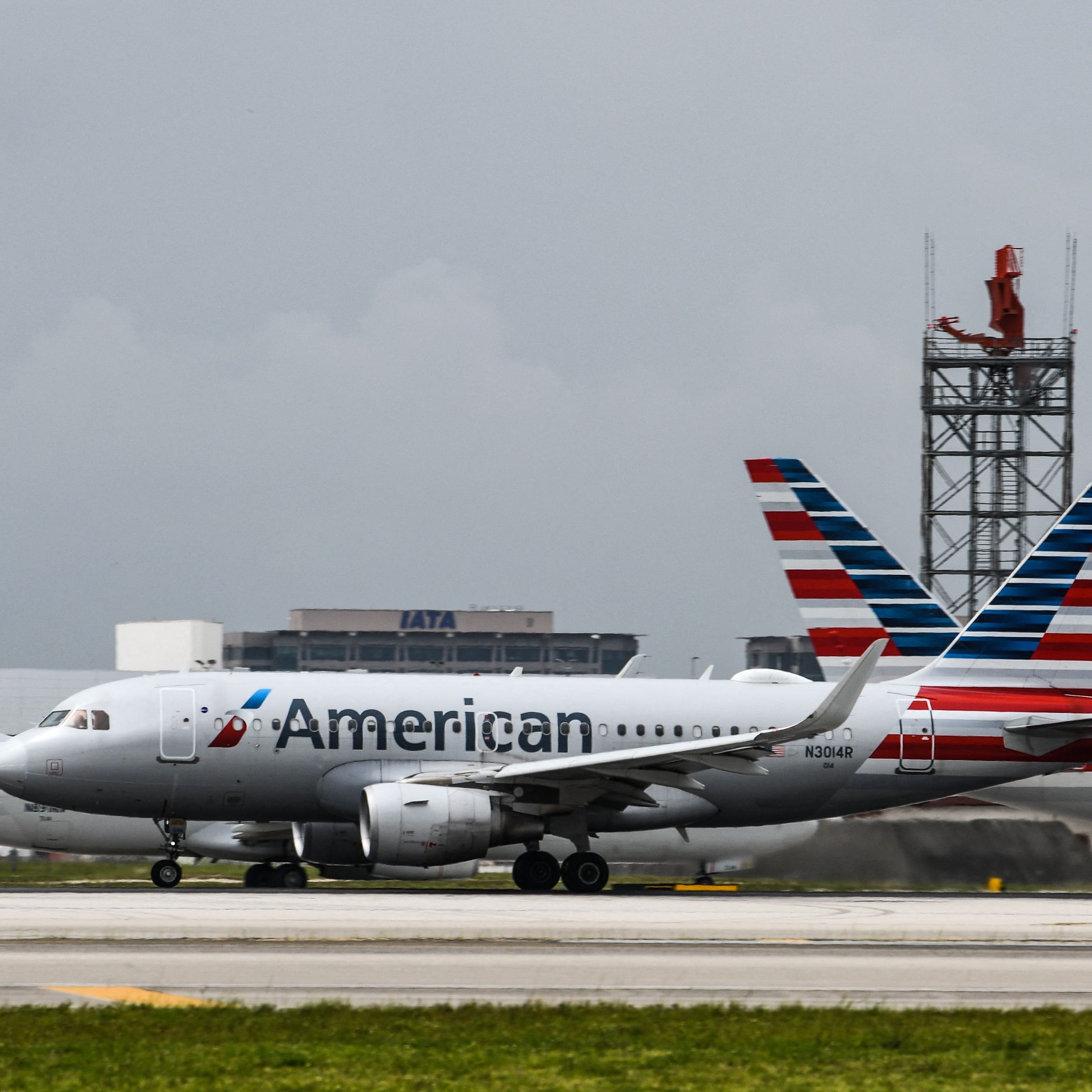 (FILES) In this file photo taken on June 16, 2021, American Airlines planes taxi at Miami International Airport in Miami. - American Airlines reported its first profitable quarter since Covid-19 broke out on July 22, 2021, and said current booking trends will lift travel volumes closer to pre-pandemic levels in the third quarter. (Photo by CHANDAN KHANNA / AFP) (Photo by CHANDAN KHANNA/AFP via Getty Images) ORG XMIT: 0 ORIG FILE ID: AFP_9FM9A8.jpg