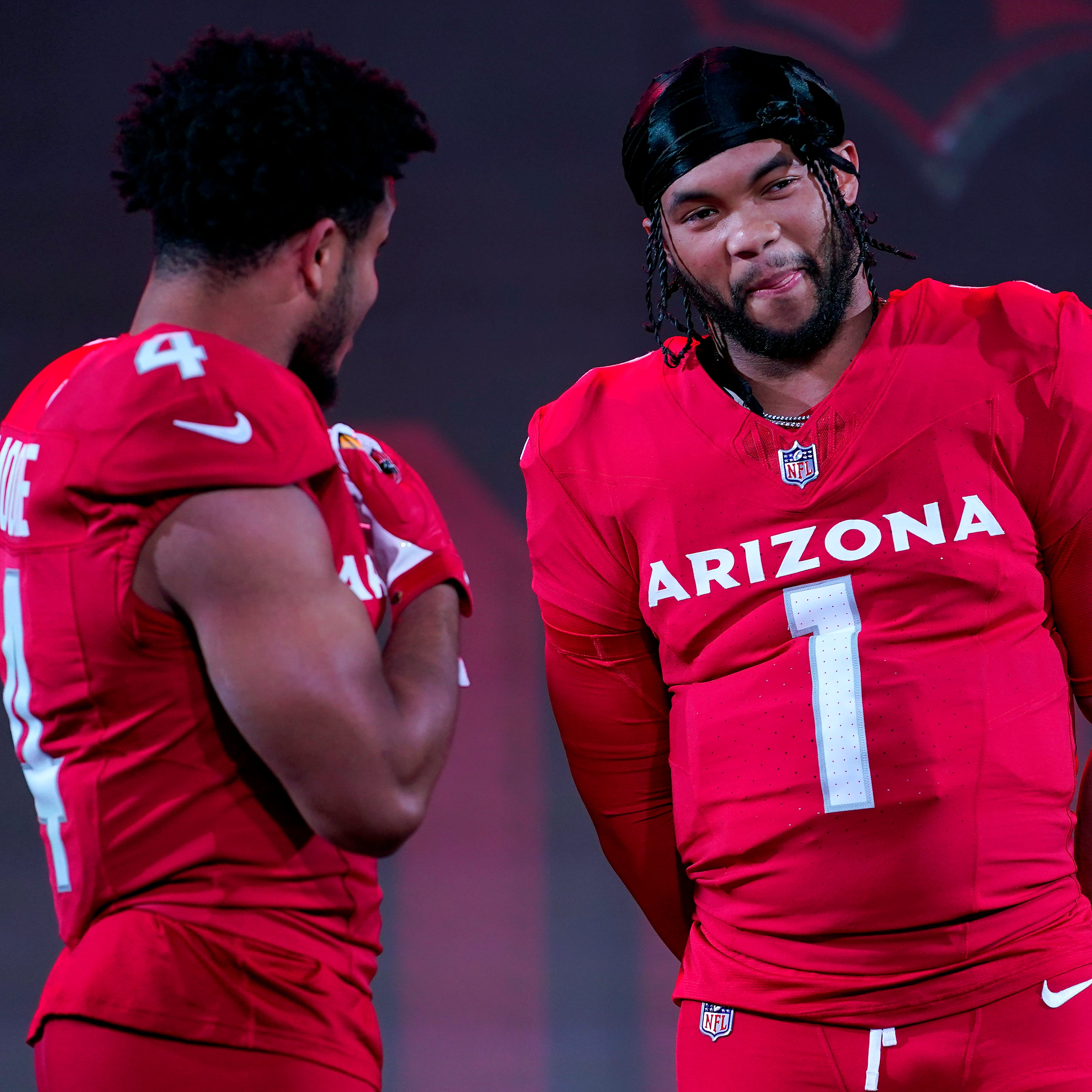 Arizona Cardinals quarterback Kyler Murray (1) and wide receiver Rondale Moore showcase the NFL football teams' new uniforms for the 2023 season, Thursday, April 20, 2023, in Phoenix.