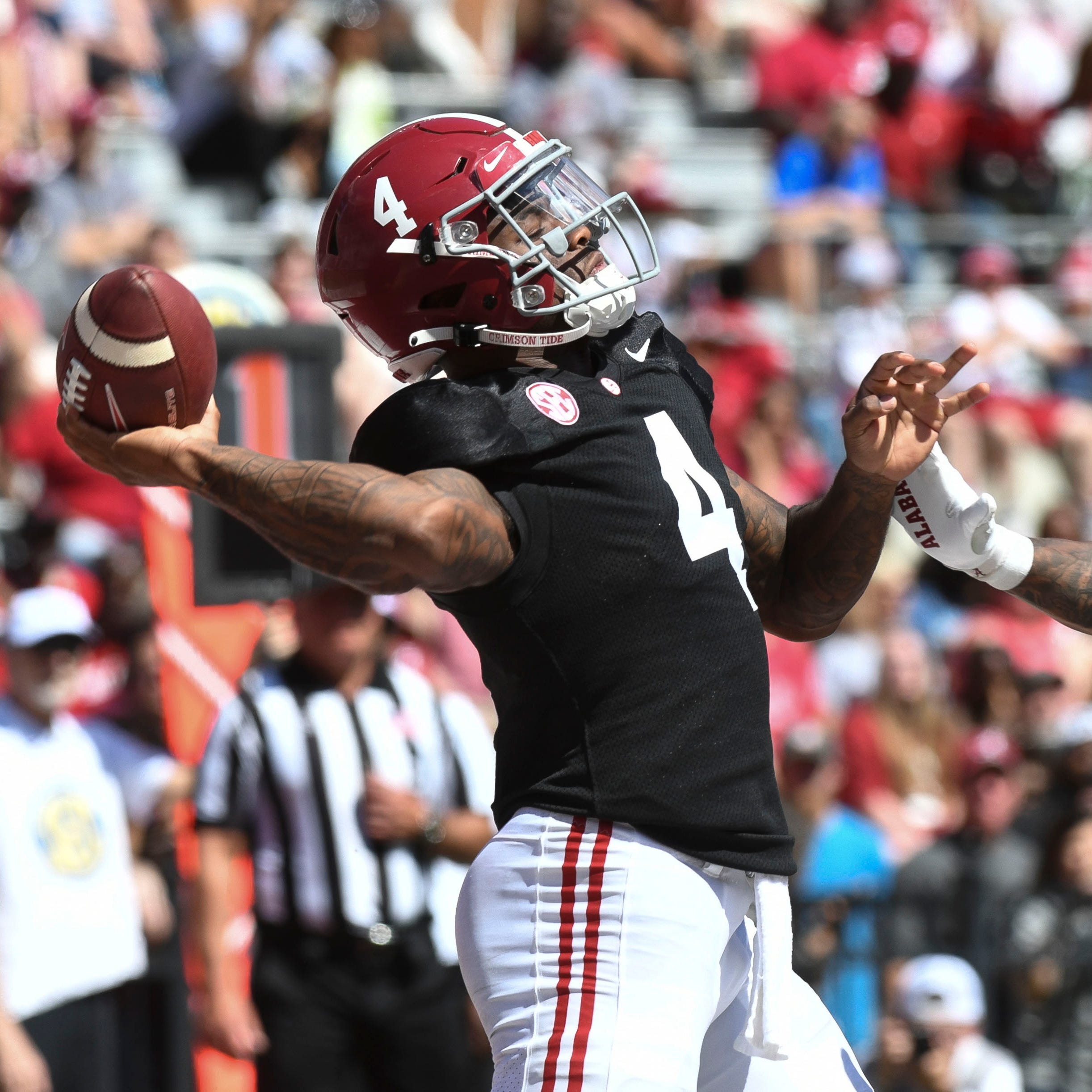 Quarterback Jalen Milroe (4) throws a pass during the Alabama spring game.