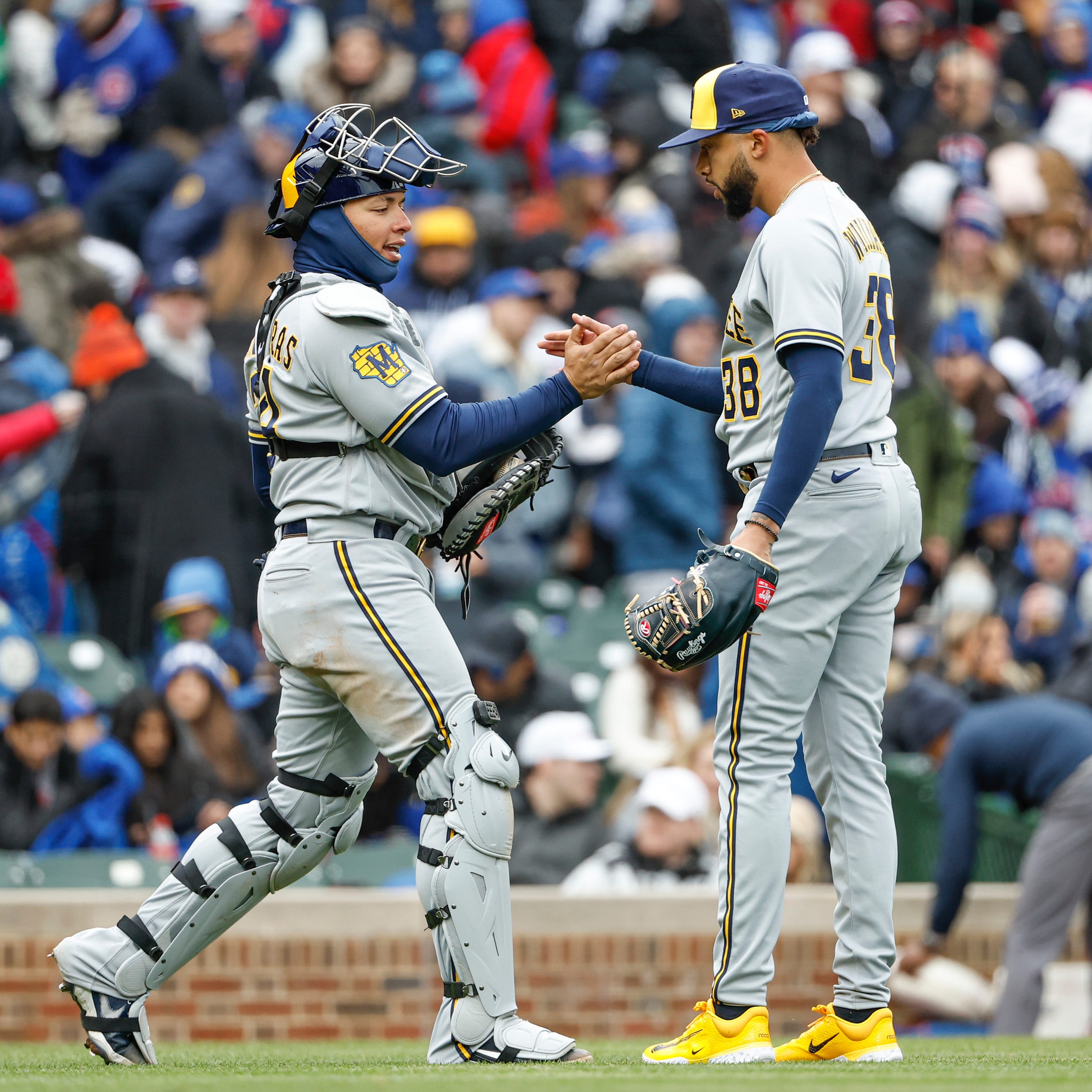 Brewers relief pitcher Devin Williams celebrates with catcher William Contreras after a win.