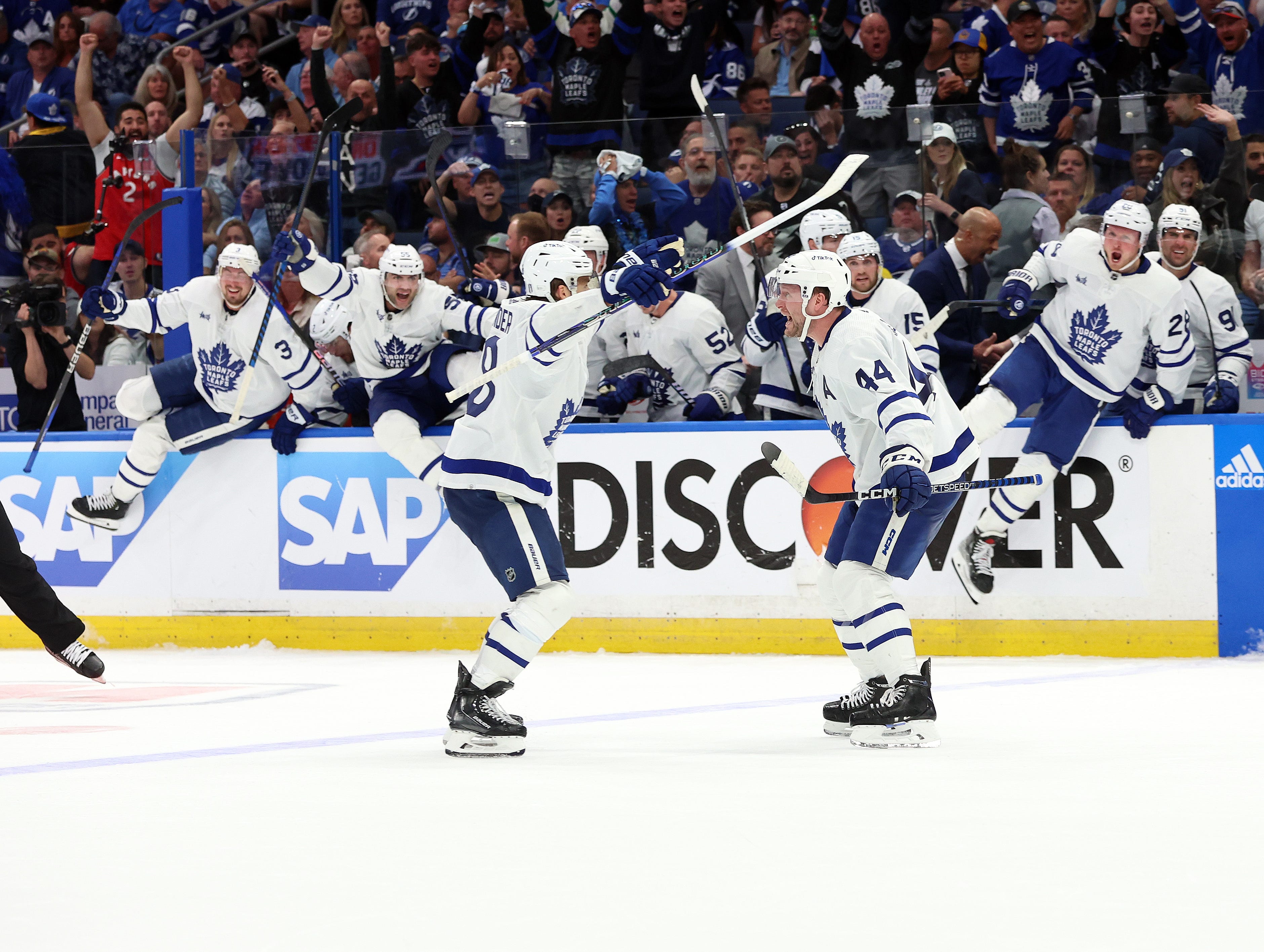 Maple Leafs' Morgan Rielly sparks line brawl with hit, scores in overtime against Lightning