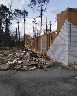 A photo captures damage from a tornado that tore apart the Curtis V. Cooper primary care facility in Pembroke last year.