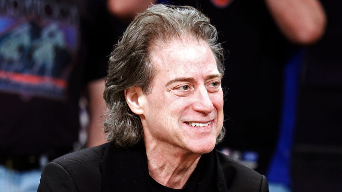 FILE - Comedian Richard Lewis attends an NBA basketball game in Los Angeles on Dec. 25, 2012. Lewis is retiring from stand-up following four surgeries and a diagnosis of Parkinson's disease. The 75-year-old 