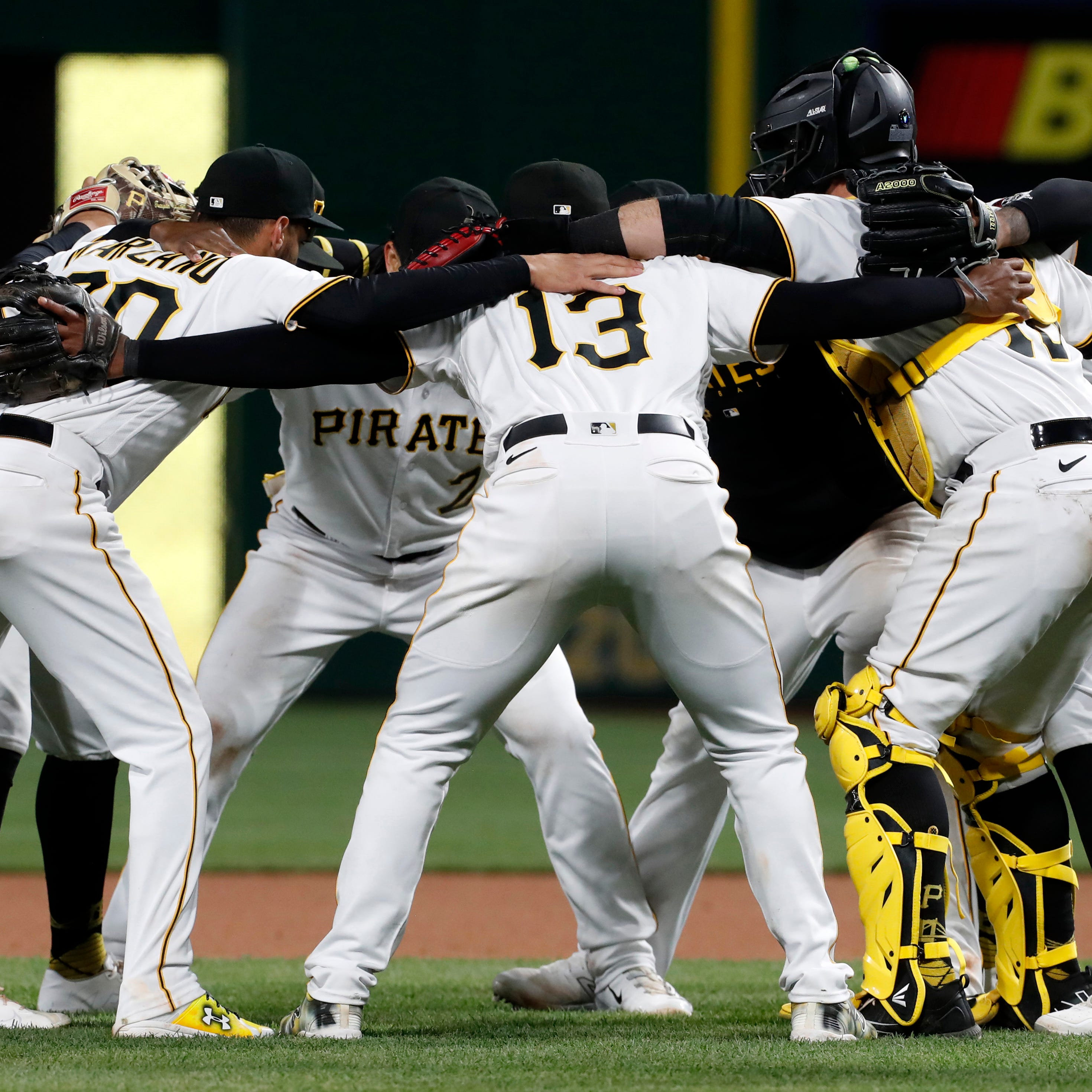 Pirates infielders and battery mates celebrate after defeating   the Reds at PNC Park.
