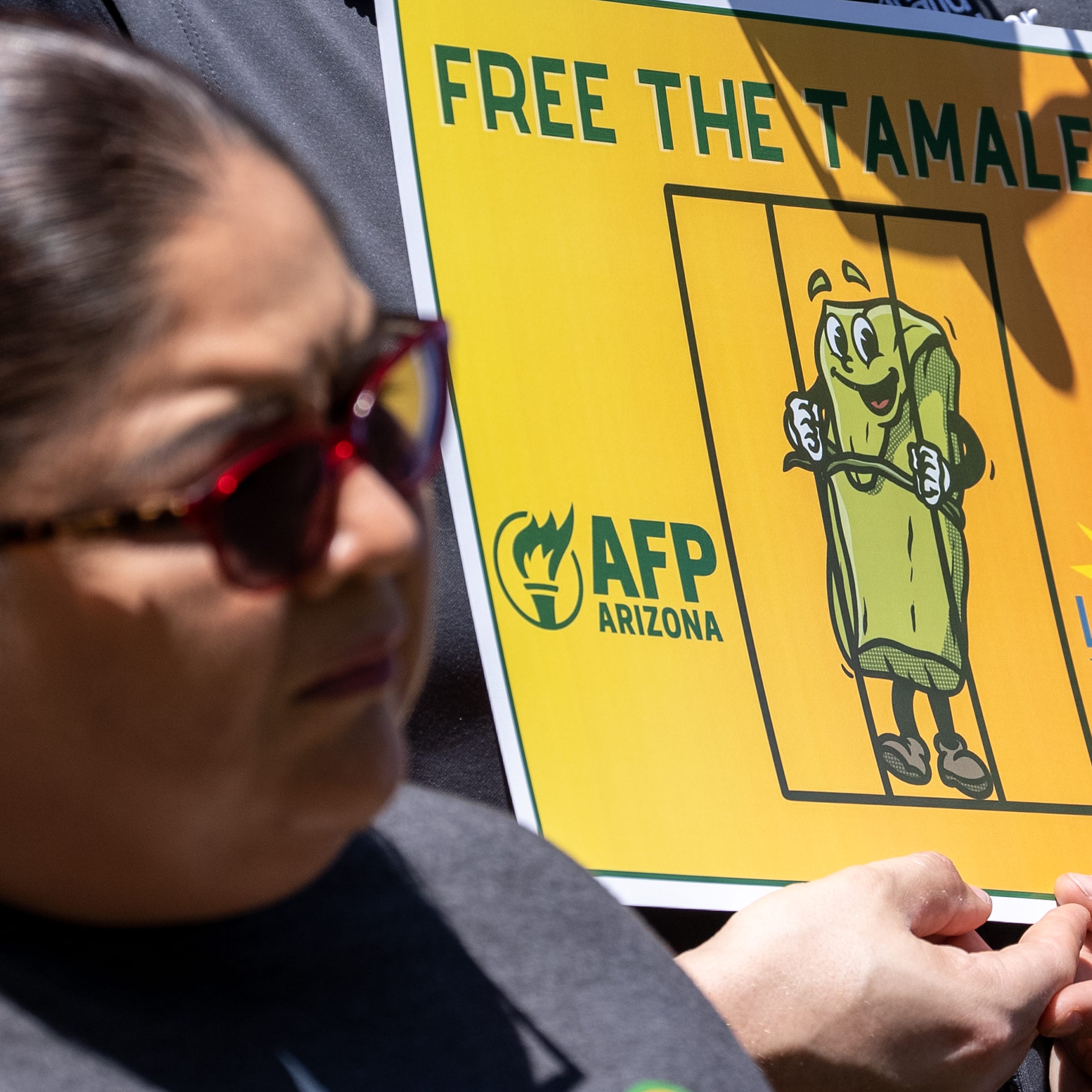 People gather to protest Governor Katie Hobbs' veto of House Bill 2509 outside the Arizona state Capitol in Phoenix on April 25, 2023.