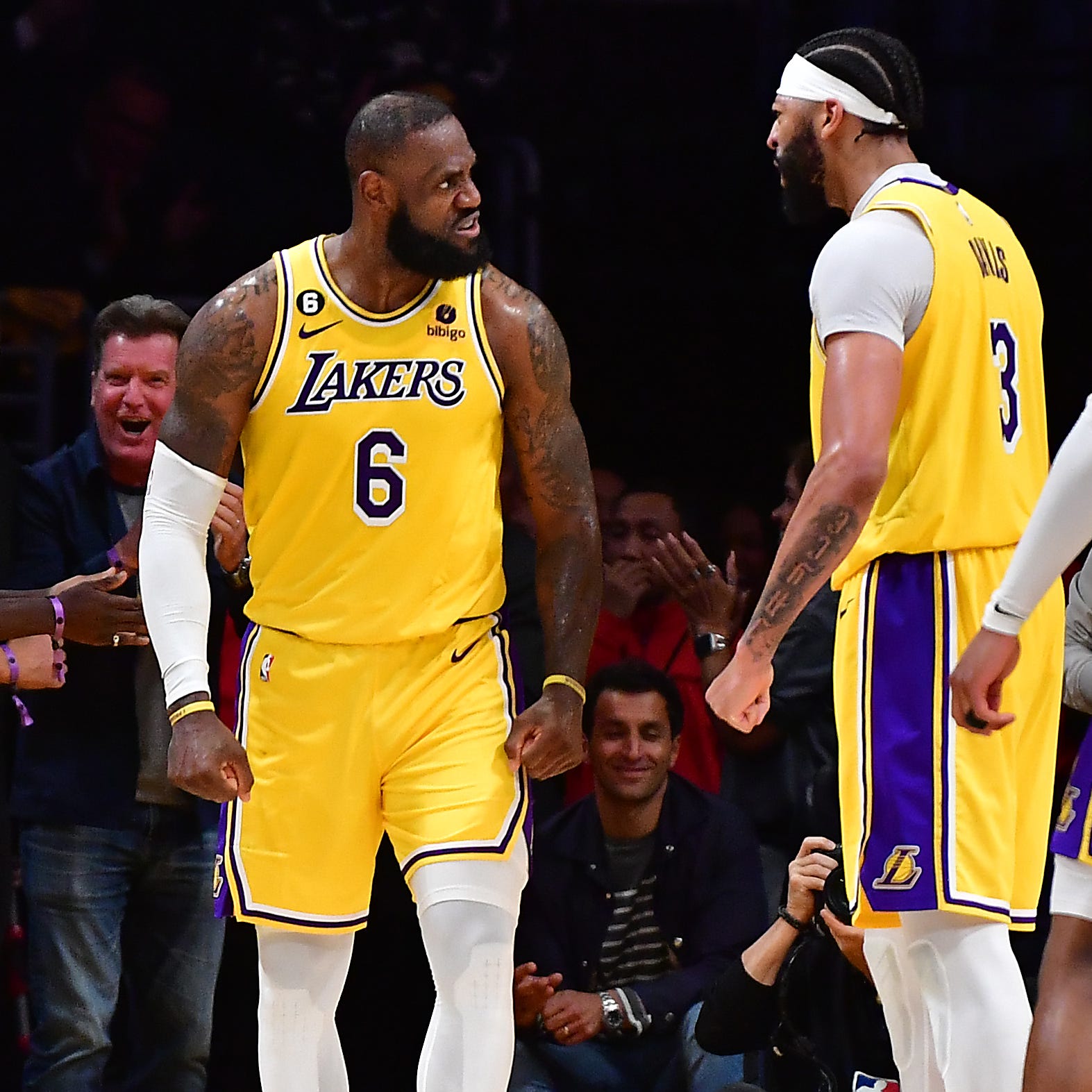Los Angeles Lakers forward LeBron James reacts after making a basket in overtime.