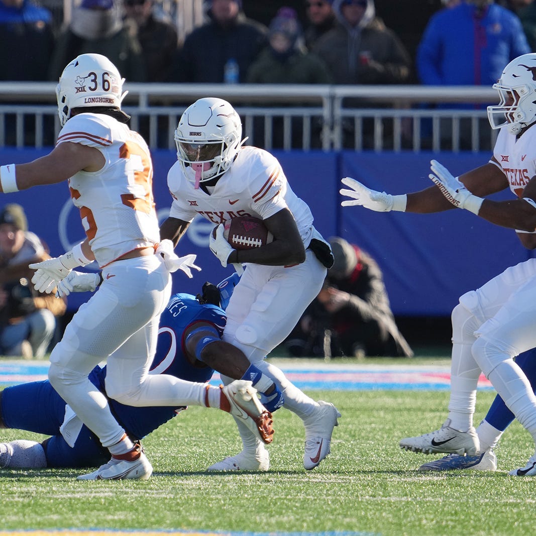 Texas wide receiver Xavier Worthy (8) carries the ball against Kansas during their game in on Saturday, Nov. 19, 2022.    Ut Ku Football Mlc 00149