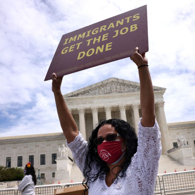WASHINGTON, DC - MAY 12: An immigration activist participates in a rally near the U.S. Supreme Court as they demonstrate to highlight immigrant essential worker rights, on May 12, 2021 in Washington, DC. The group marched on Capitol Hill as the Senate Judiciary Committee held a subcommittee hearing on the role of essential immigrant workers in America."