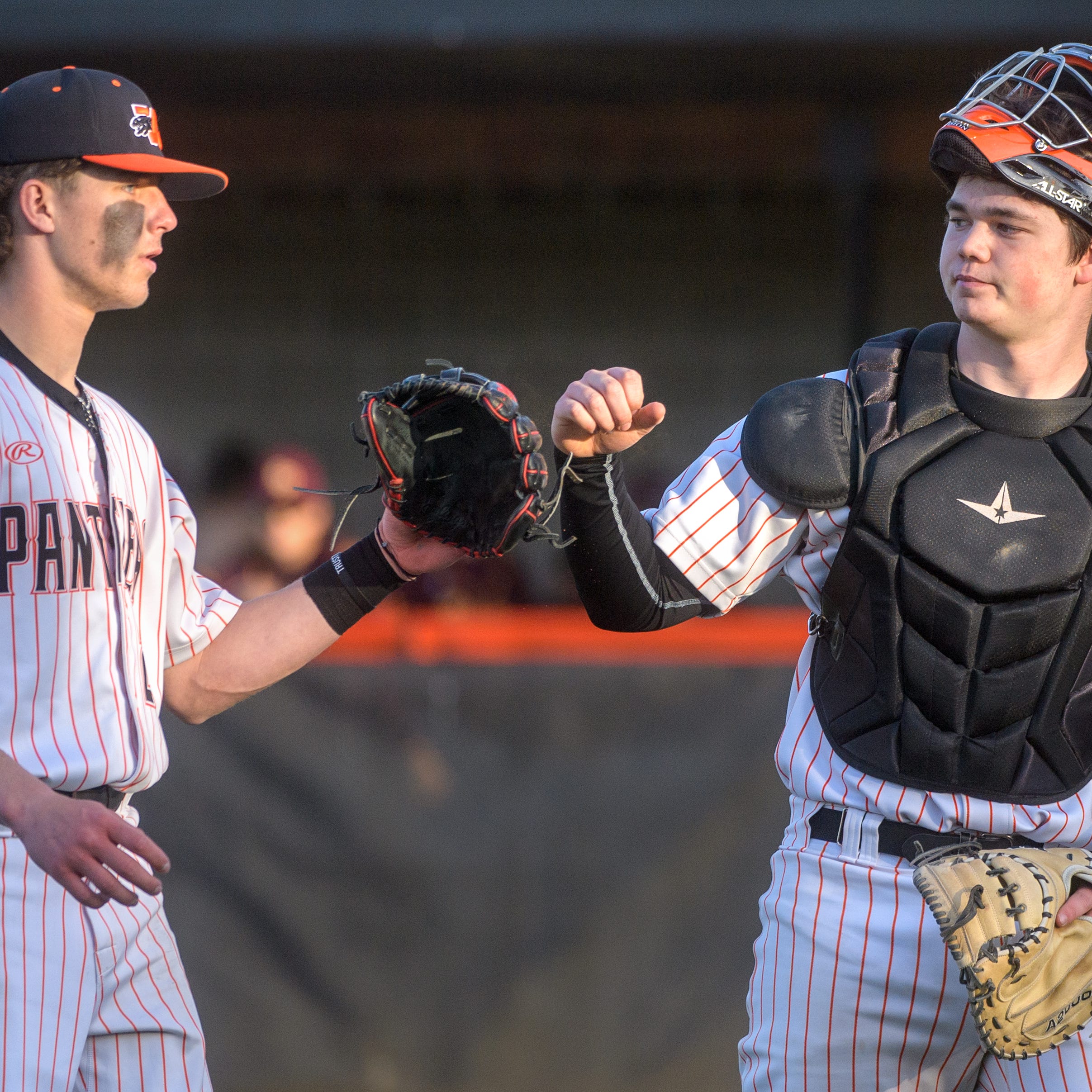 Washington pitcher Braden Vanderheydt, left, and catcher Keegan Isbell celebrate at the end of an inning against East Peoria on Wednesday, April 26, 2023 in Washington.