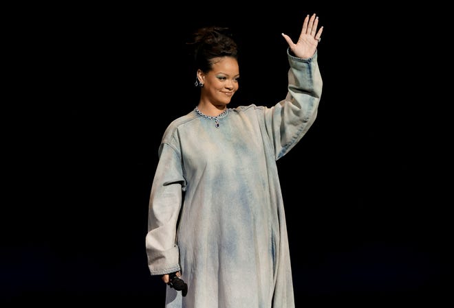 Rihanna speaks onstage promoting the upcoming Smurfs film at CinemaCon.