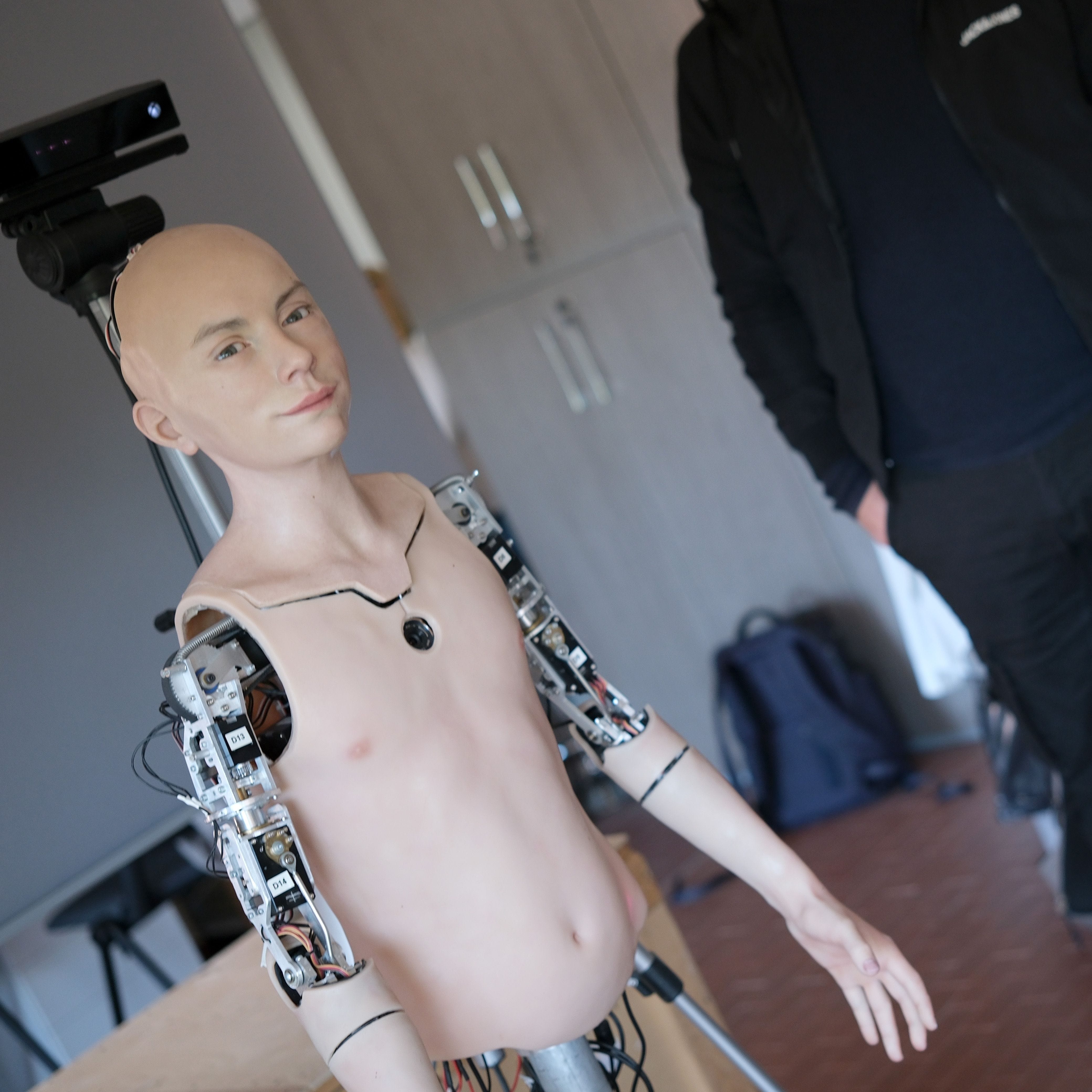 The humanoid robot Abel interacts with scientist Lorenzo Cominelli on April 26, 2023, in Pisa, Italy.  Abel has been created by bioengineers at the Pisa University and an artist from a Biomimic company to read human emotions.
