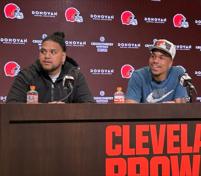 Cleveland Browns third-round draft picks Siaka Ika, left, and Cedric Tillman talk at an introductory press conference on Saturday, April 29, 2023.