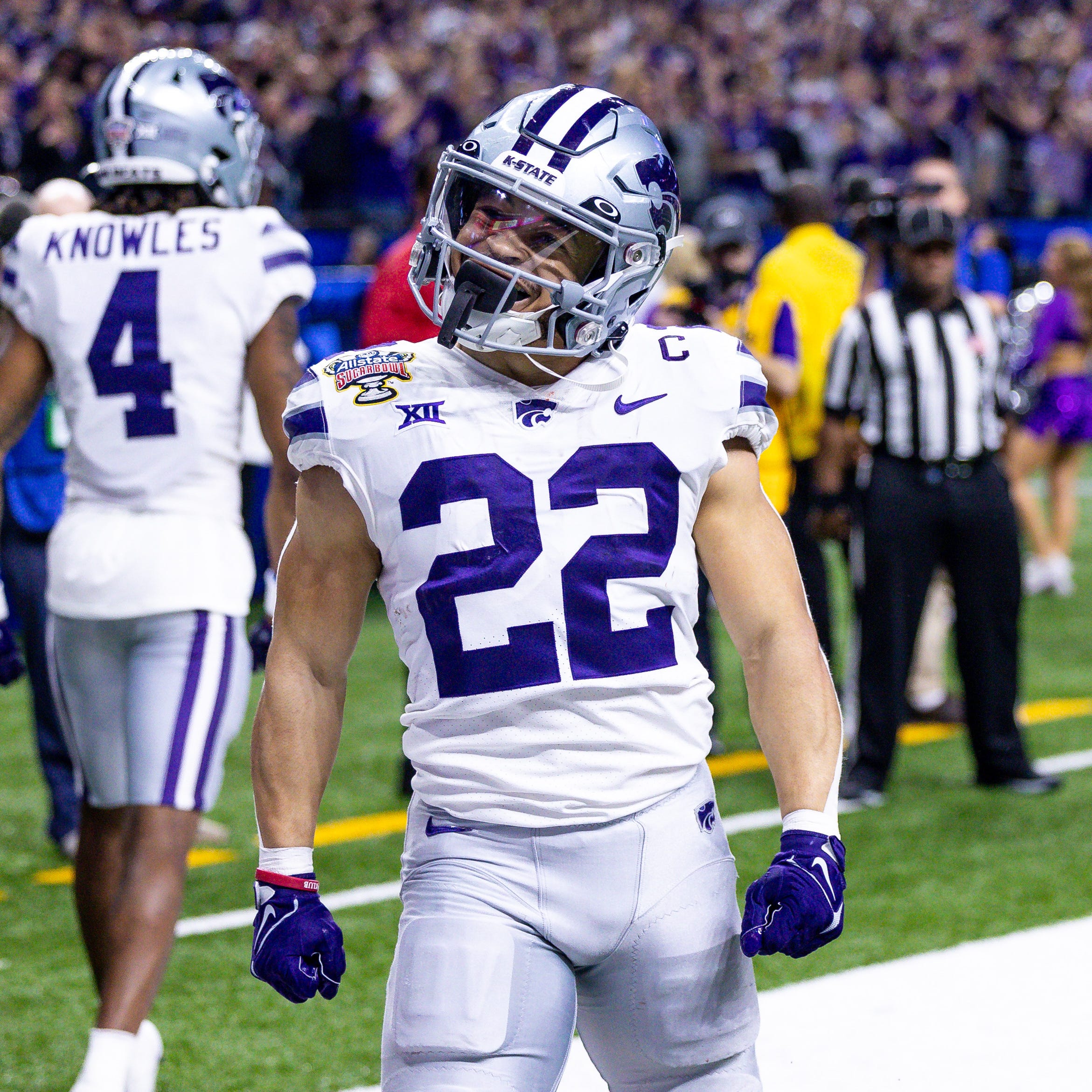 Kansas State Wildcats running back Deuce Vaughn (22) celebrates his touchdown scored against the Alabama Crimson Tide during the first half in the 2022 Sugar Bowl at Caesars Superdome.