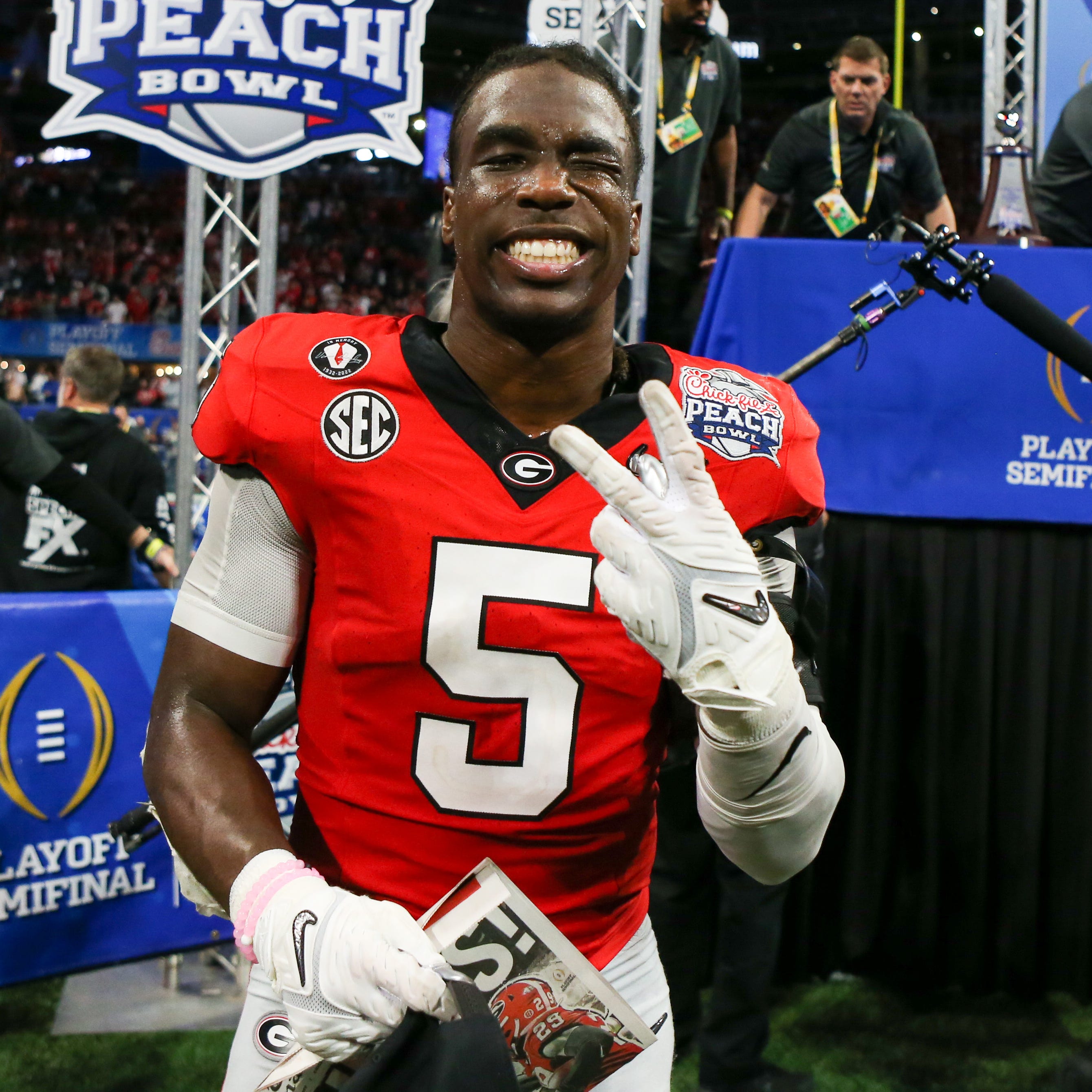 Georgia Bulldogs defensive back Kelee Ringo (5) celebrates after a victory against the Ohio State Buckeyes in the 2022 Peach Bowl at Mercedes-Benz Stadium.