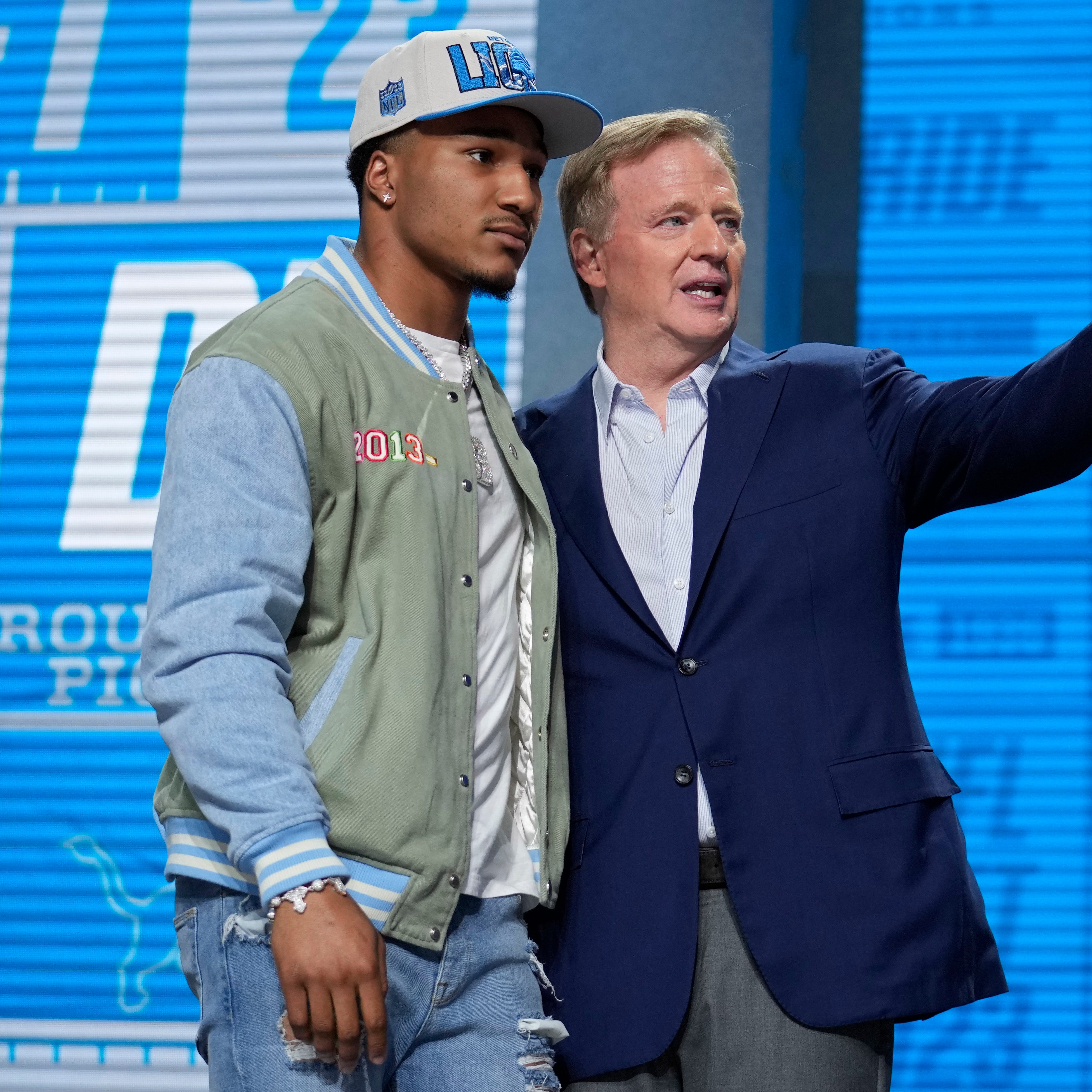 Alabama defensive back Brian Branch, left, speaks with NFL Commissioner Roger Goodell after being chosen by the Detroit Lions during the second round of the NFL football draft, Friday, April 28, 2023, in Kansas City, Mo.