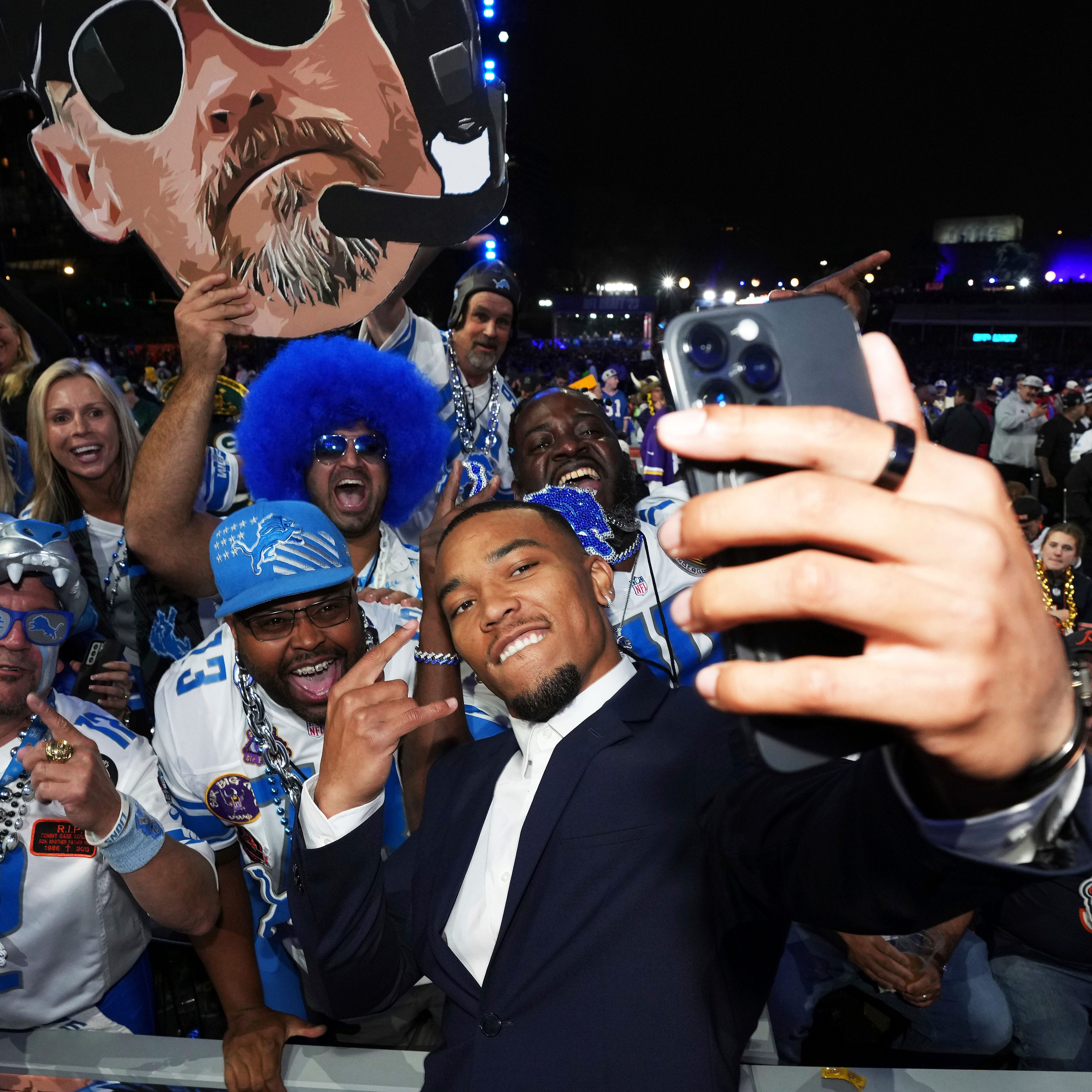 Detroit Lions Wide Receiver Amon-Ra St. Brown joins Detroit Lions fans during the 2023 NFL Draft, Friday, April 28, 2023, in Kansas City, Mo.