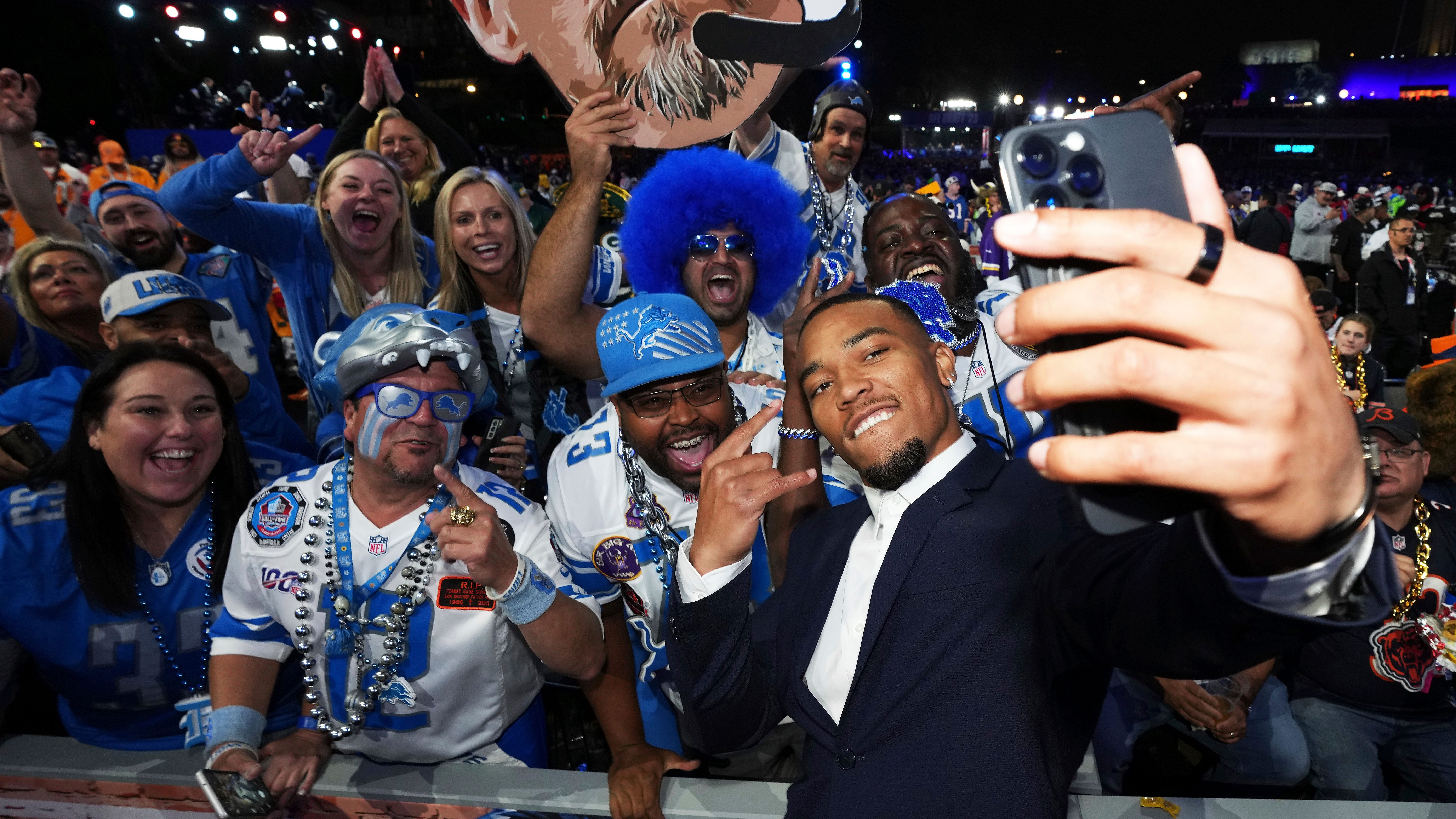 Detroit Lions Wide Receiver Amon-Ra St. Brown joins Detroit Lions fans during the 2023 NFL Draft, Friday, April 28, 2023, in Kansas City, Mo.
