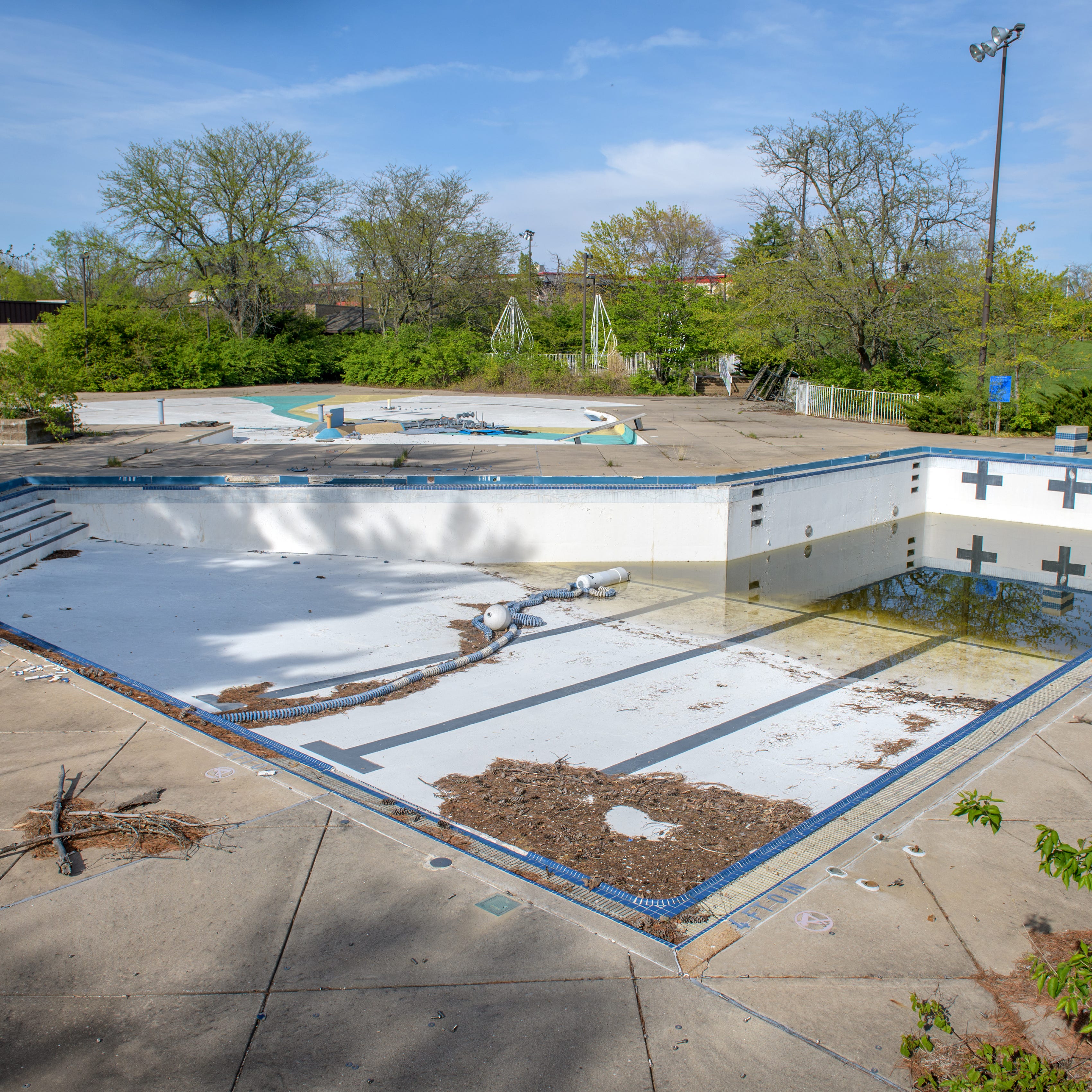 Rainwater sits in the drained pool and the long-shuttered Lakeview Aquatic Center at Lakeview Park in Peoria.