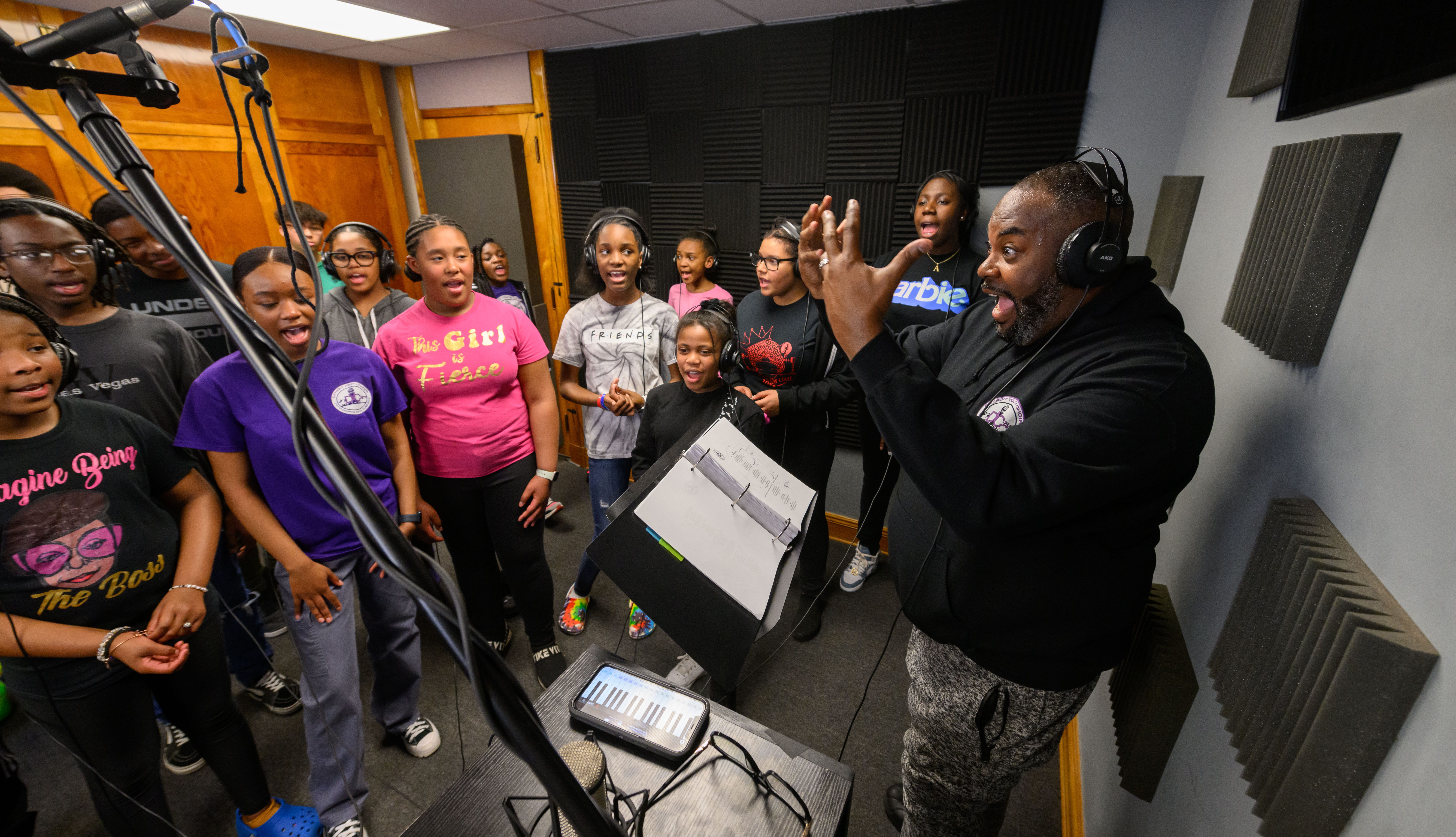 Anthony White, director of the Detroit Youth Choir, leads the choir in a recording session inside their studio at Marygrove Conservancy, in Detroit, April 27, 2023.