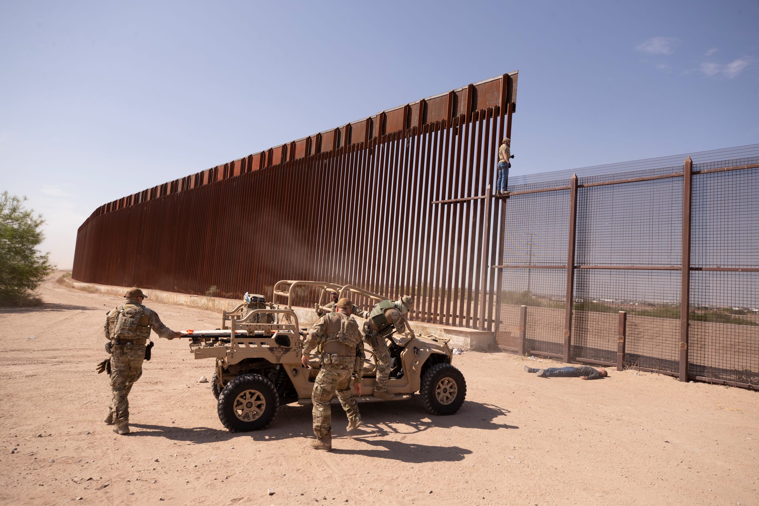 Border Patrol Search, Trauma, and Rescue simulate a rescue of a victim who would have fallen from the border wall during a demonstration in El Paso, Texas on May 2, 2023.