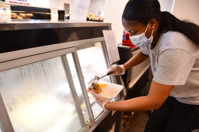 Line cook Janasia Sneed prepares healthy hot deli food and breakfast meals to go to Evans Center and Market, a key low-to-middle income hub in Melbourne and Palm Bay. increase.