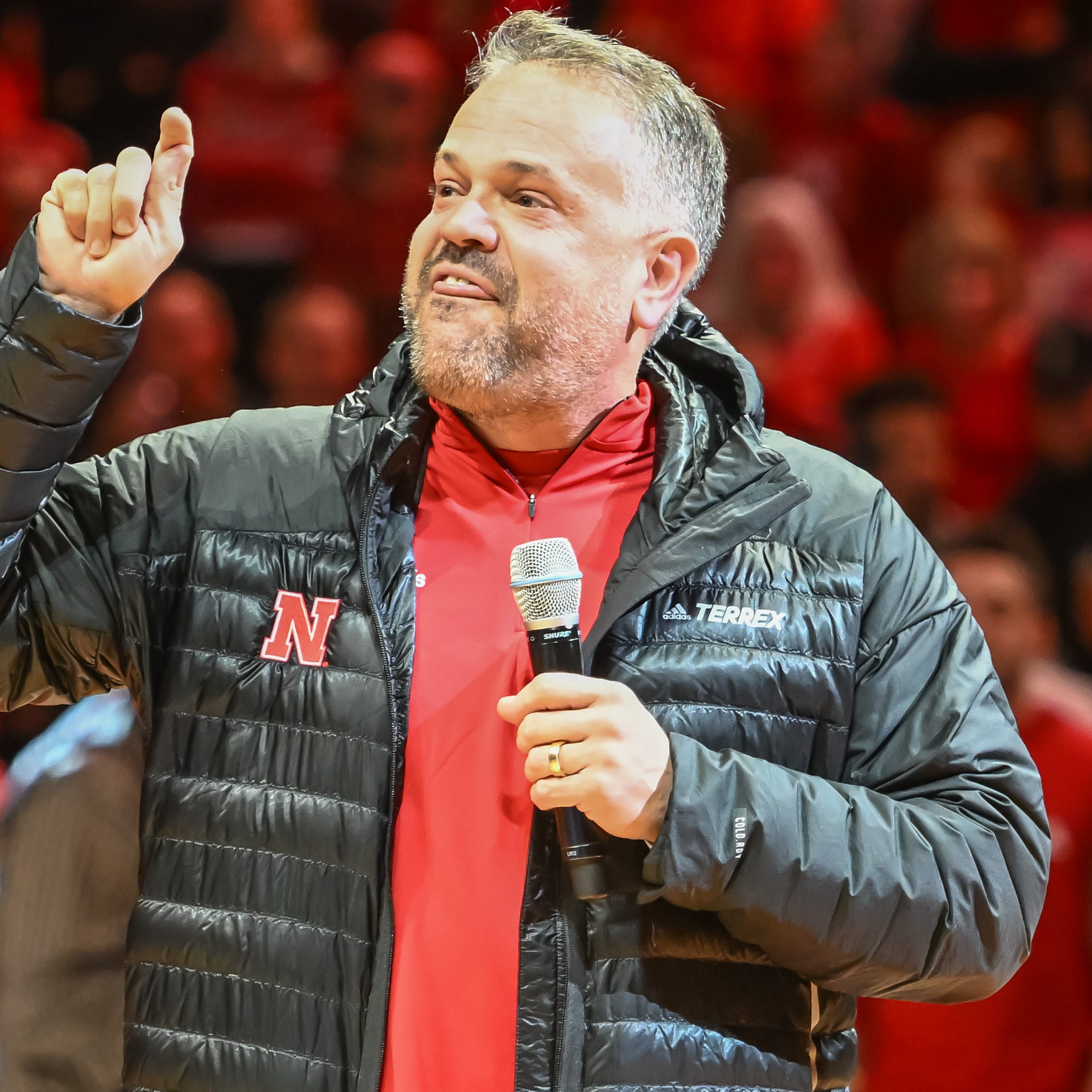 Nebraska football coach Matt Rhule talks to the crowd during halftime of the the school's men's basketball game against Purdue at Pinnacle Bank Arena.