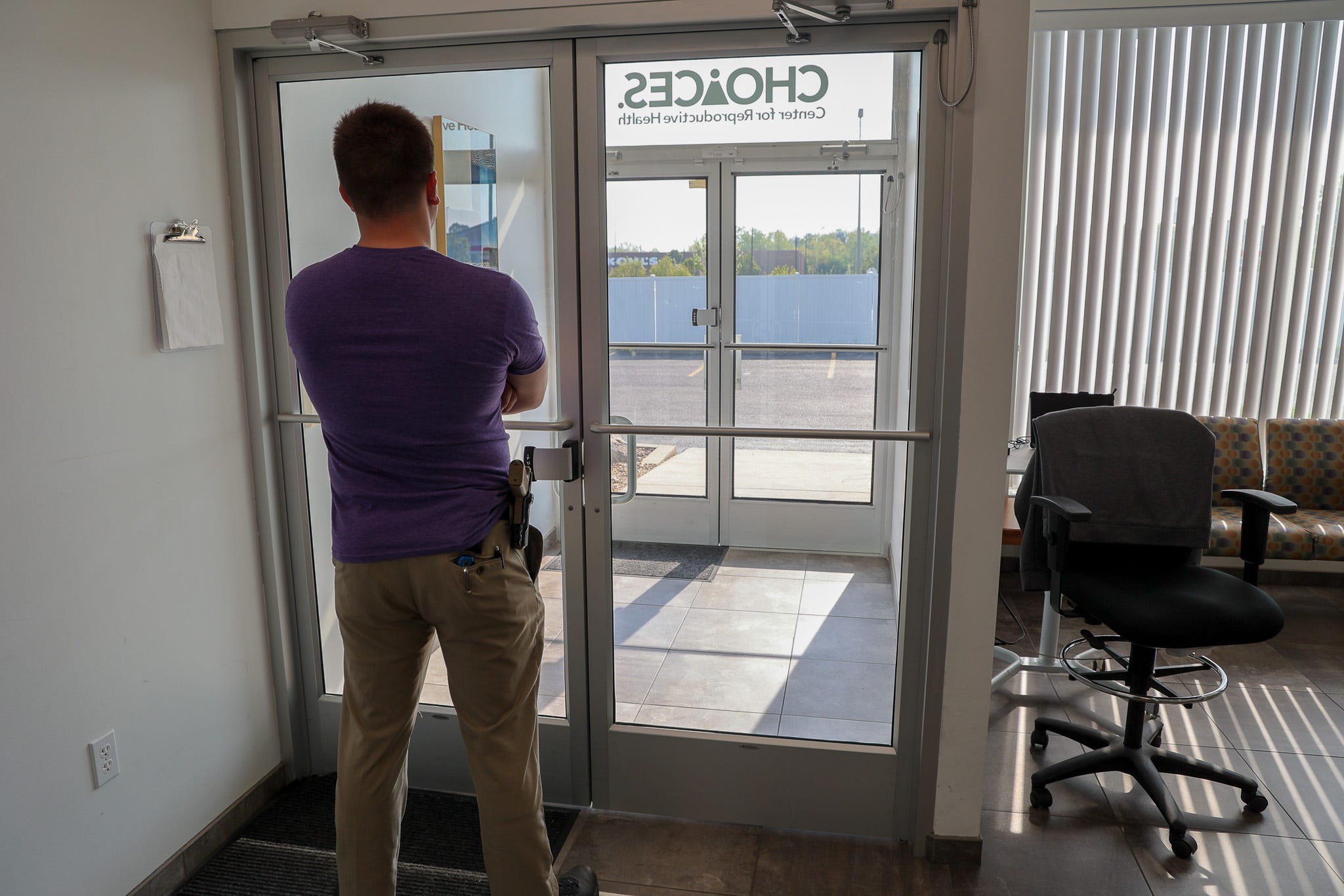 A security guard stands inside Choices Center for Reproductive Health in Carbondale, Illinois. April 2023.