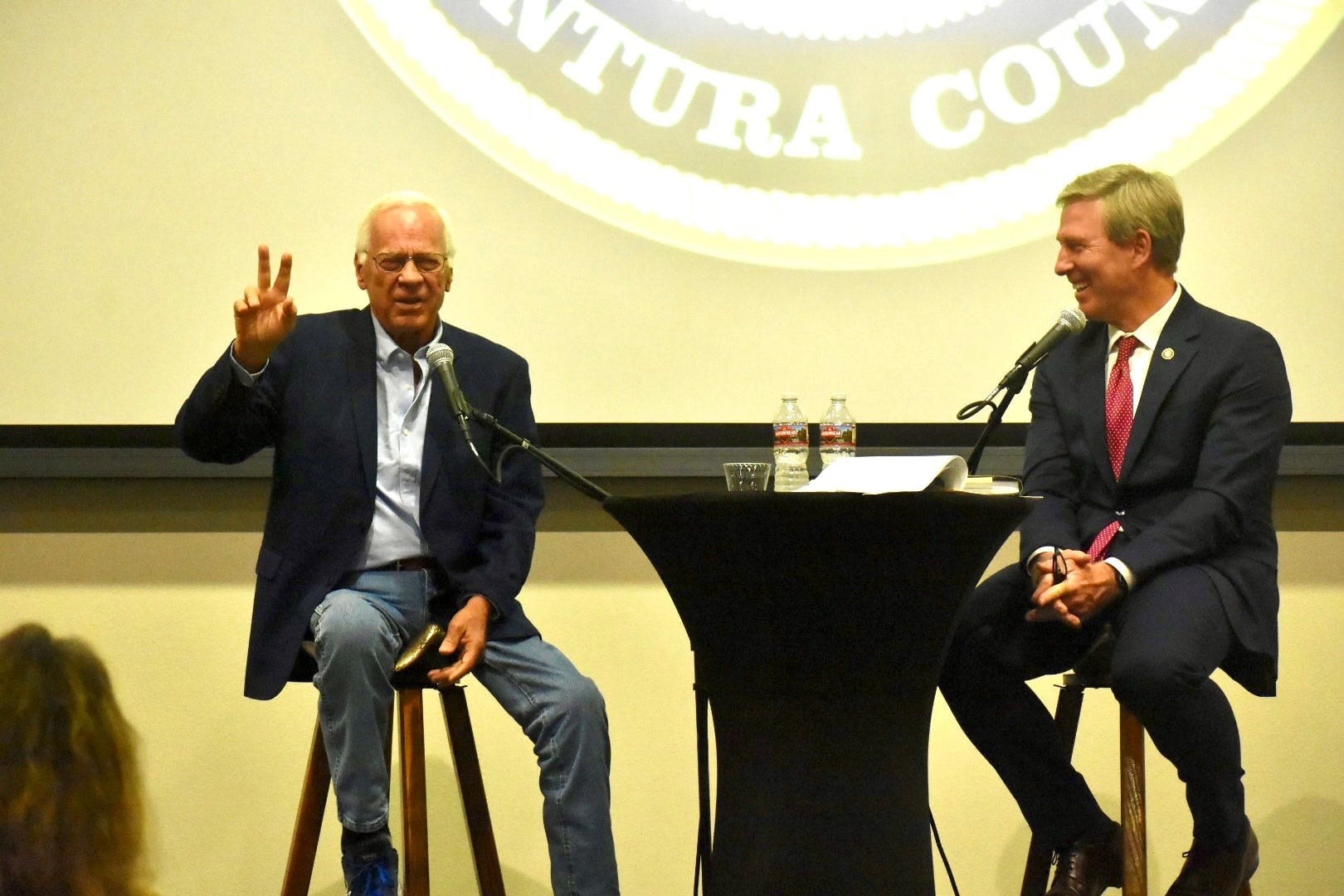 Former District Attorney Mike Bradbury, left, is interviewed by current DA Erik Nasarenko at the Museum of Ventura County on May 3.