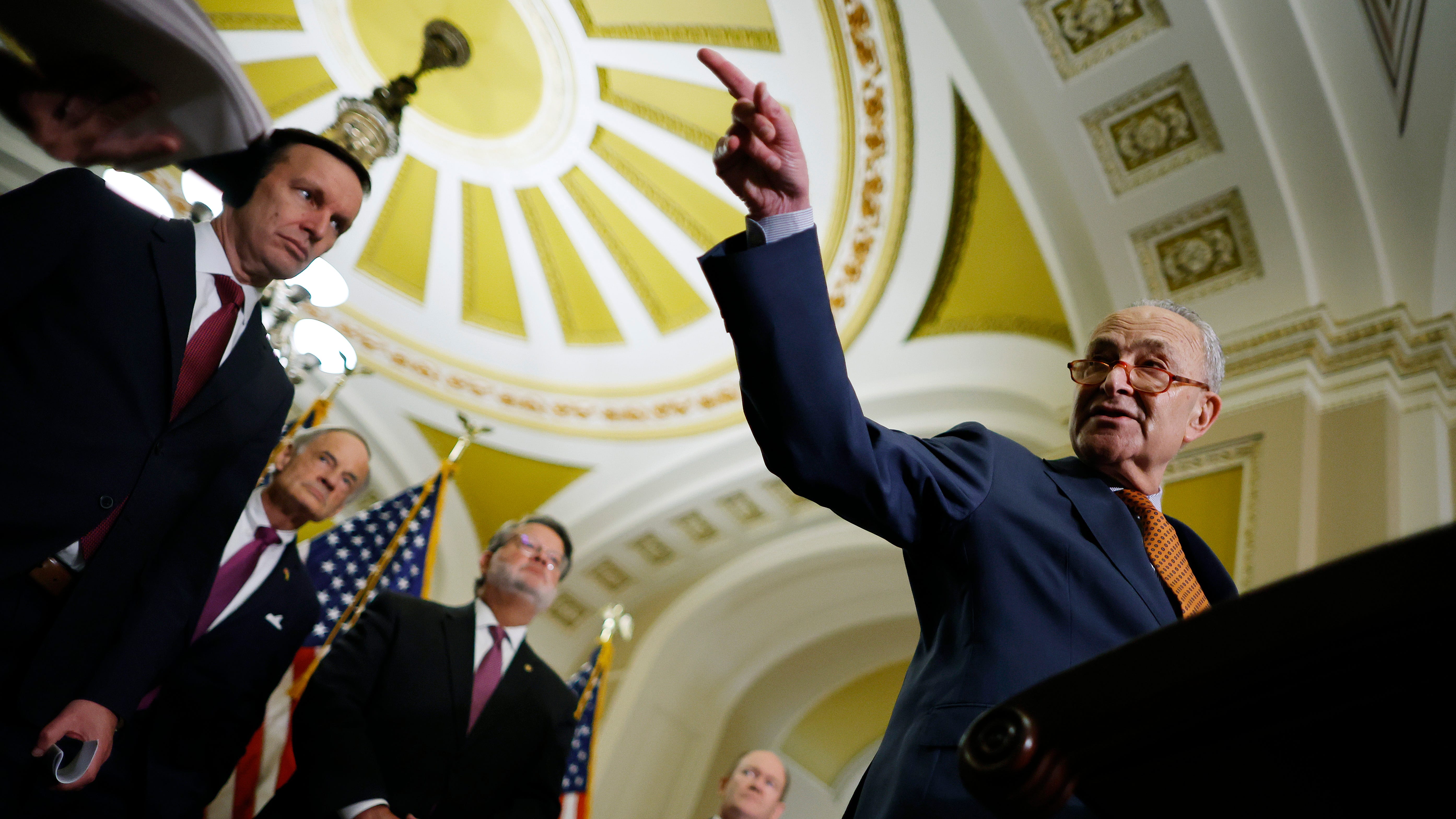May 3, 2023: Senate Majority Leader Charles Schumer (D-NY) calls on reporters while talking about the Senate Democrats' proposed China competitiveness legislation with (L-R) Sen. Chris Murphy (D-CT), Sen. Tom Carper (D-DE), Sen. Gary Peters (D-MI) and Sen. Chris Coons (D-DE) in the U.S. Capitol in Washington, DC. The Senate Democrats said they will "build off the massive CHIPS and Science Act to strengthen US manufacturing, protect American jobs, and ensure America's global leadership for generations to come."