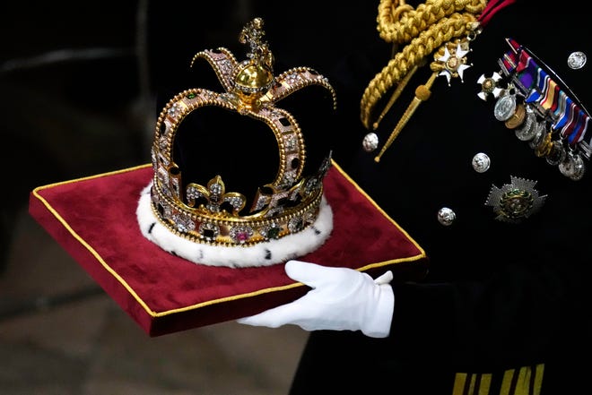 St Edward's Crown is carried during the coronation ceremony of Britain's King Charles III at Westminster Abbey in London Saturday, May 6, 2023.