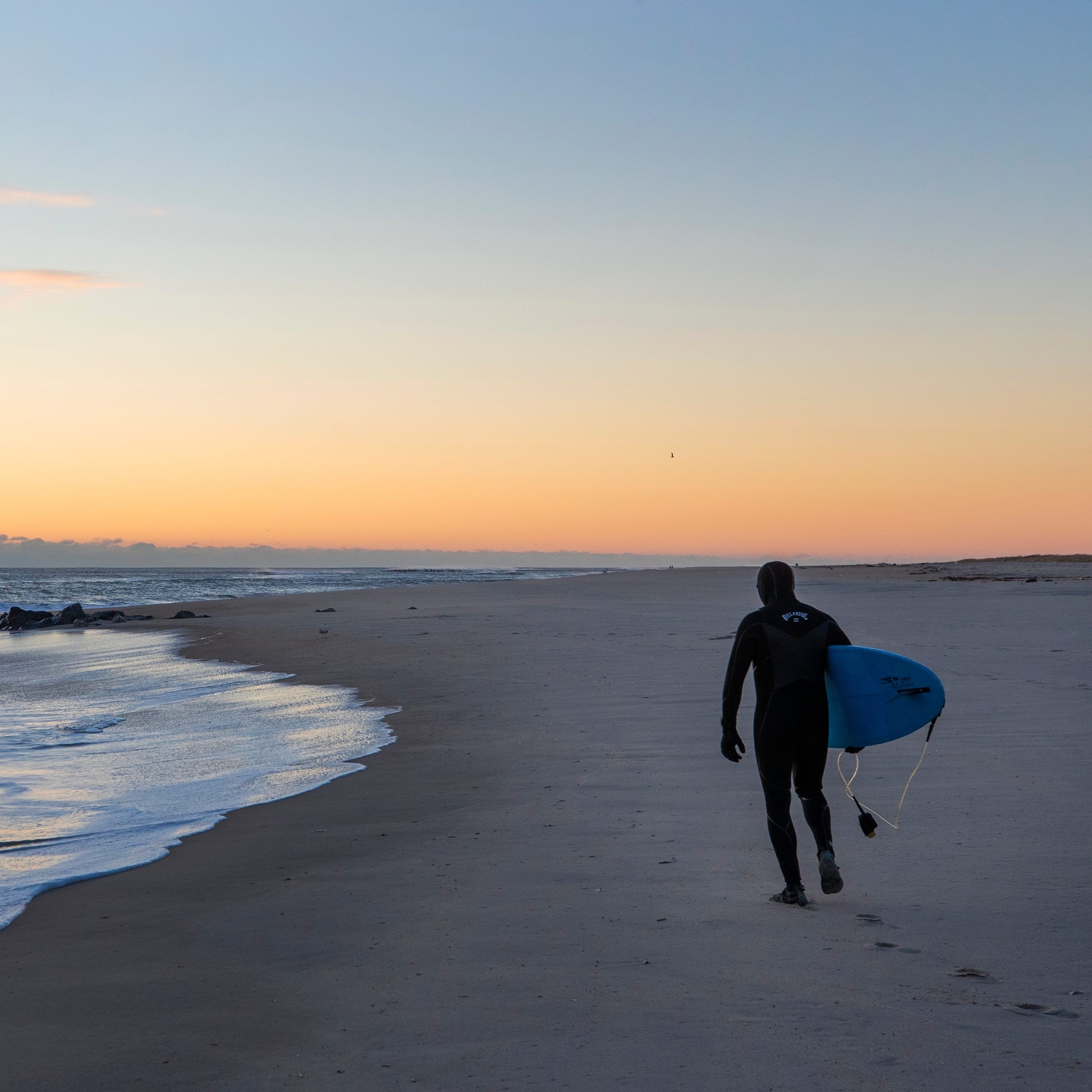 
A surfer heads out at Gateway National Recreation Area in Sandy Hook.