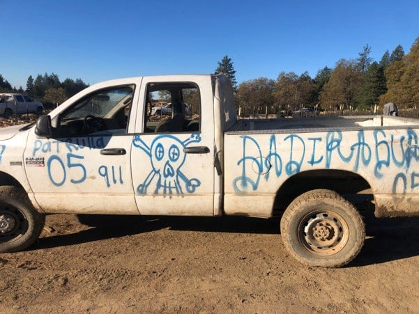 Graffiti on truck in North California mountains announcing this as a patrol unit for Mexico's infamous Sinaloa Cartel.
