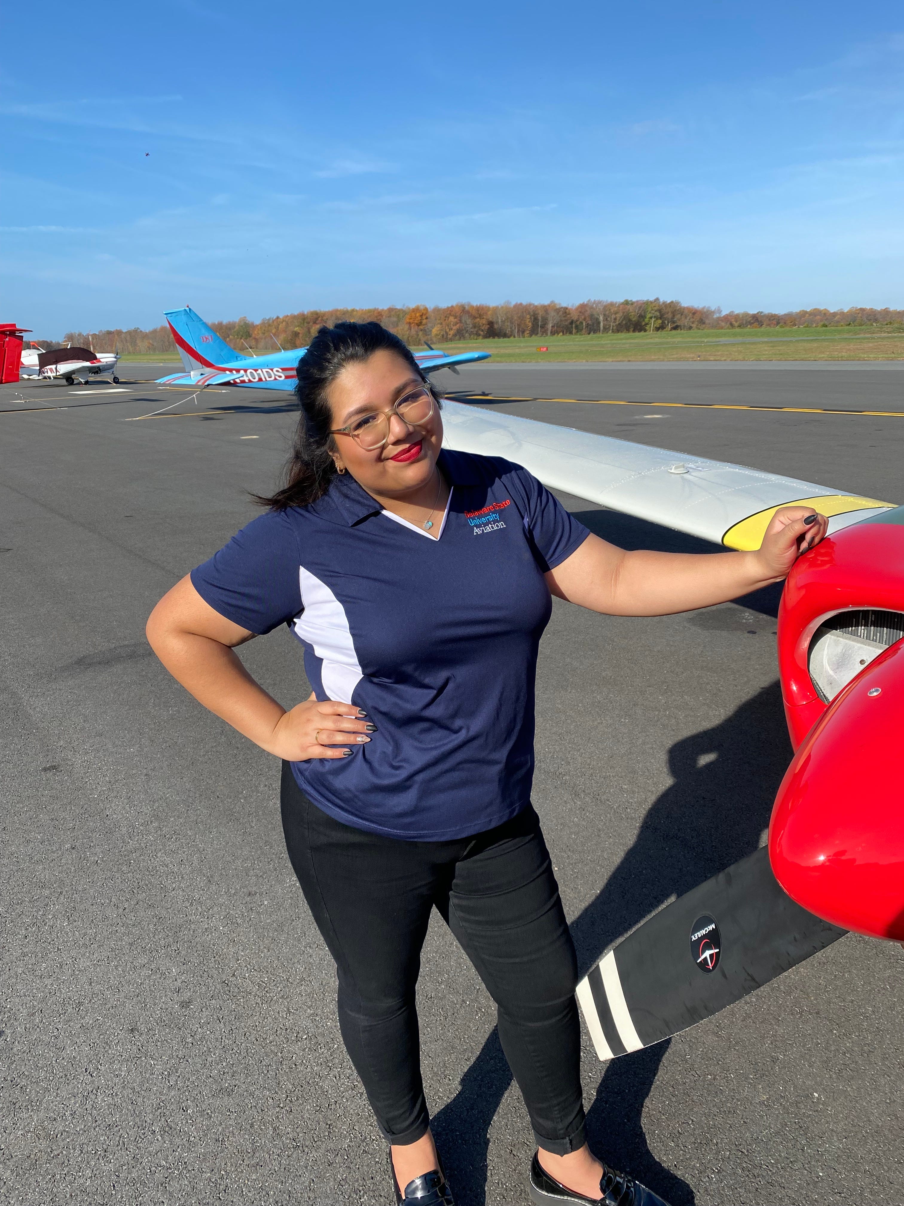 Eliana Rothwell poses at the Delaware Airpark in Dover after earning her commercial pilot certificate, while studying aviation at Delaware State University. Rothwell will graduate with a professional pilot degree in 2023.