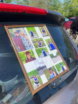 A collage of photos of Jasmine Bennett sits on a car May 9 at Lawrence Community Park.