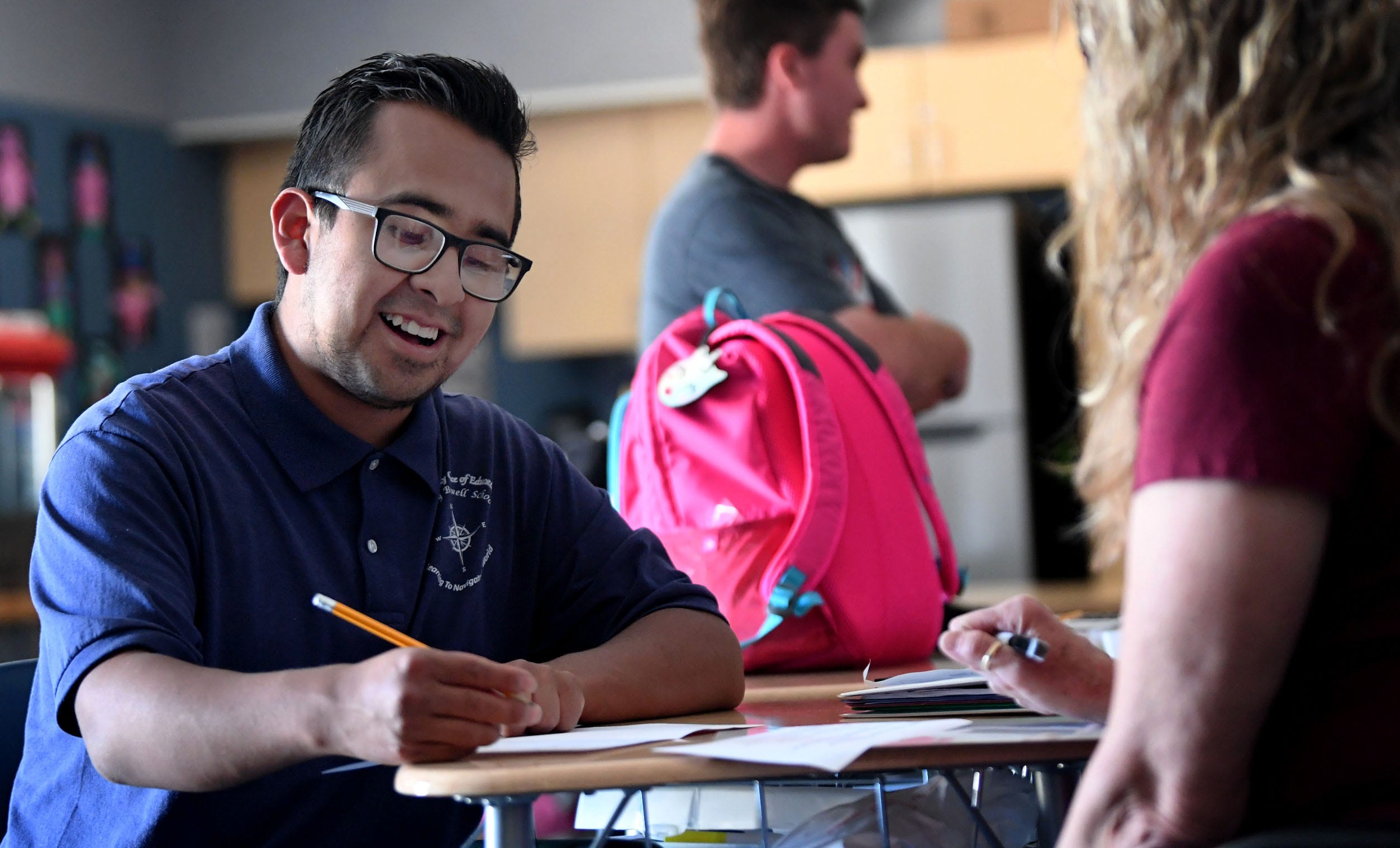 Israel Rosete-Melendez works on a Mother's Day card with help from Cindy Van Wagner, a teacher at the Dorothy Boswell School in Ventura, California, on Monday, May 8, 2023.