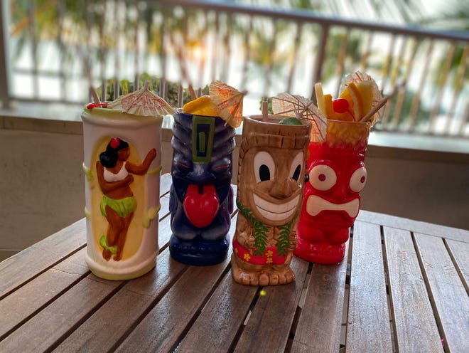 Tiki's sells drinks in cups that follow the typical tiki style.