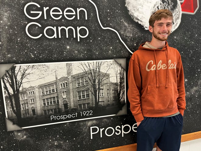 Elgin High School senior Kolby Wasserbeck plans to attend Wright State University and major in electrical engineering. He encourages younger students to work hard in school. Wasserbeck is standing next to a mural that shows a history of Elgin Local Schools.