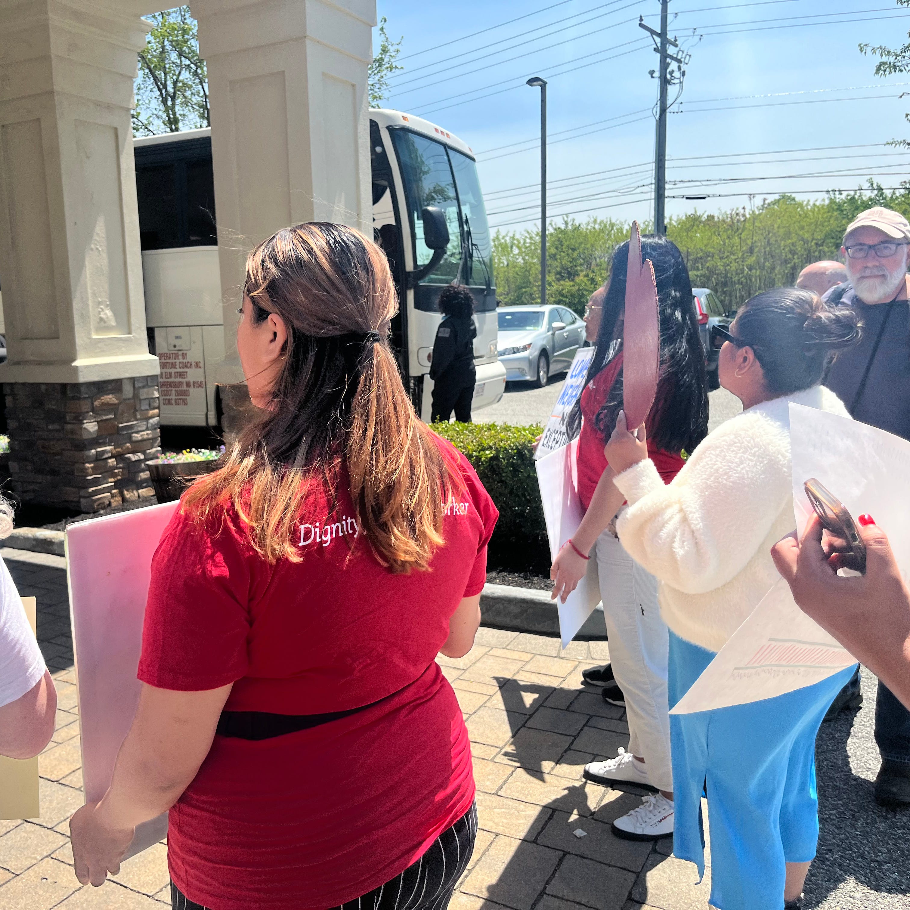 Members of grassroots organization For the Many and local elected officials greeted two buses of asylum seekers at Newburgh’s Crossroads Hotel on May 11, 2023. They were joined by other organizers, including those from the Workers Justice Center of New York and the New York Civil Liberties Union.